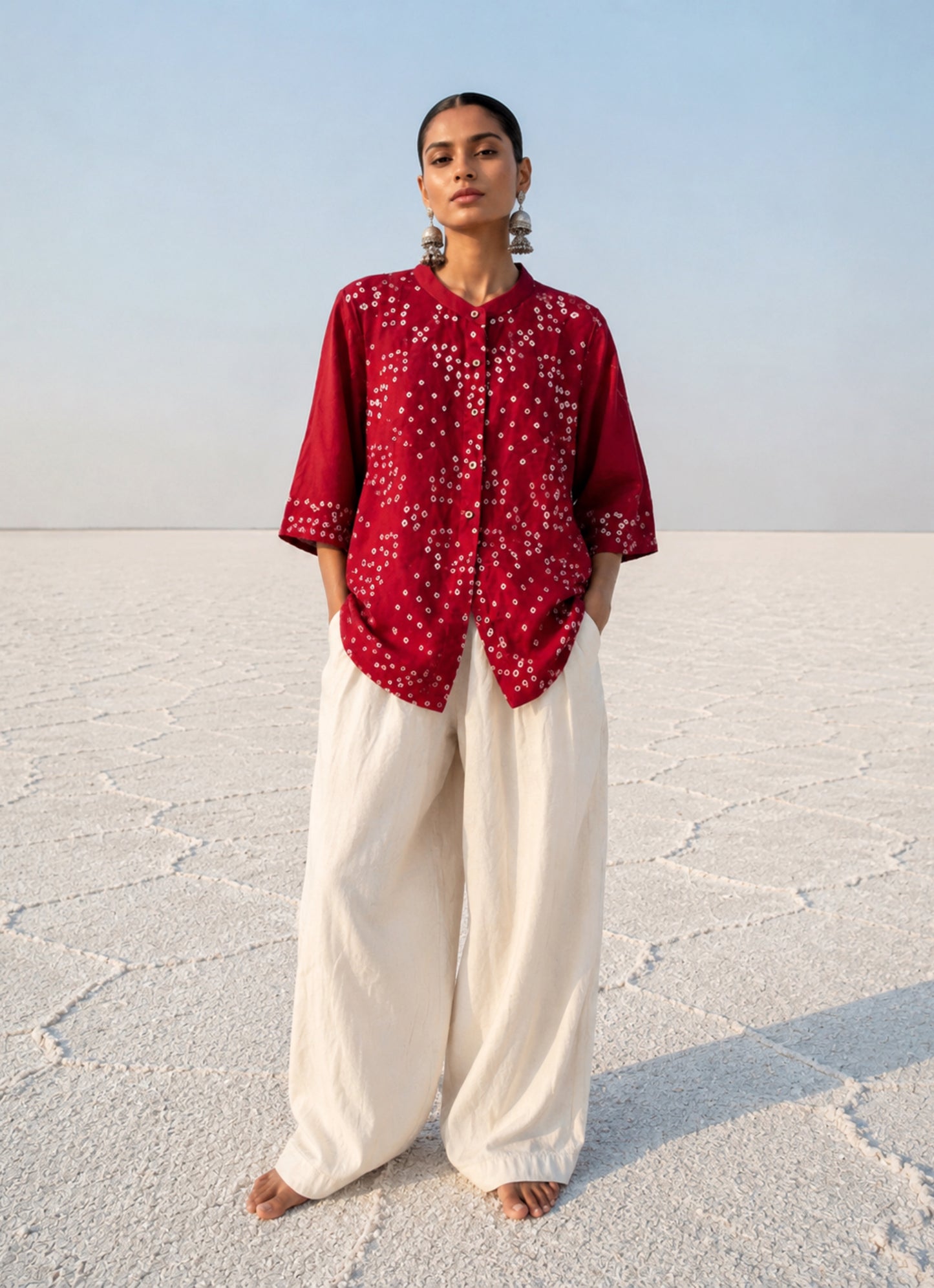 Kanku Dani red hand tie dyed Bandhani cotton satin shirt with soft mandarin collar and relaxed fit for women