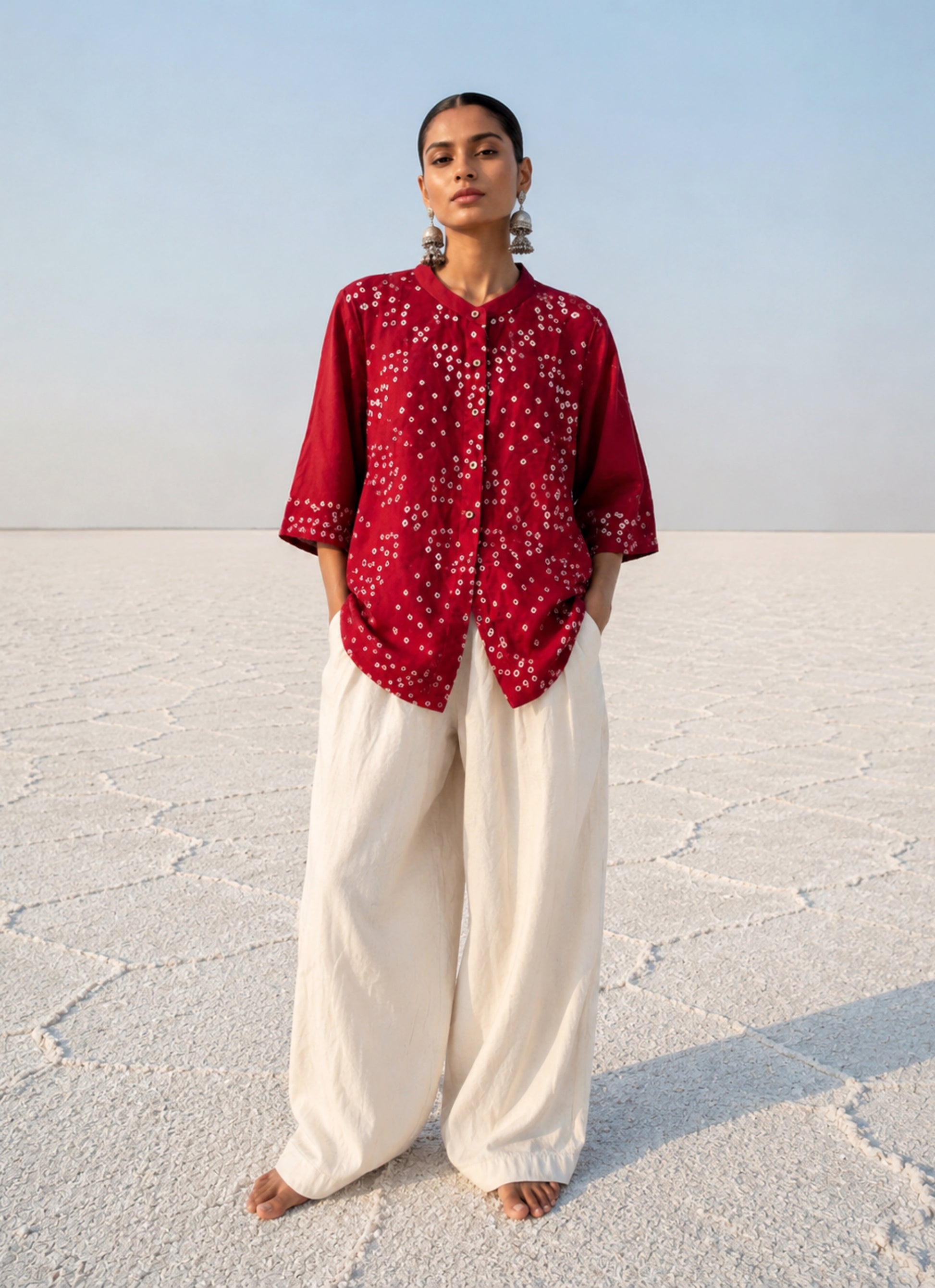 Kanku Dani red hand tie dyed Bandhani cotton satin shirt with soft mandarin collar and relaxed fit for women