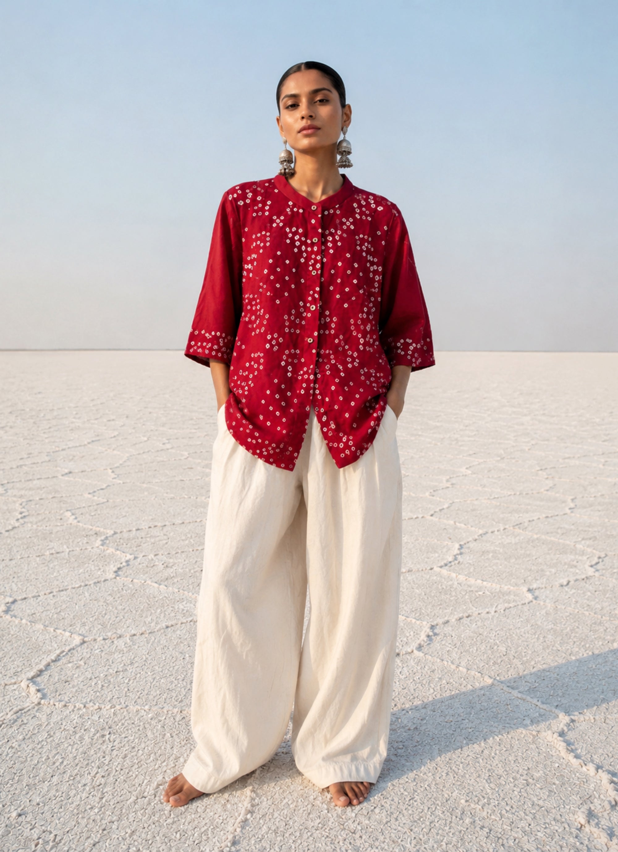Kanku Dani red hand tie dyed Bandhani cotton satin shirt with soft mandarin collar and relaxed fit for women