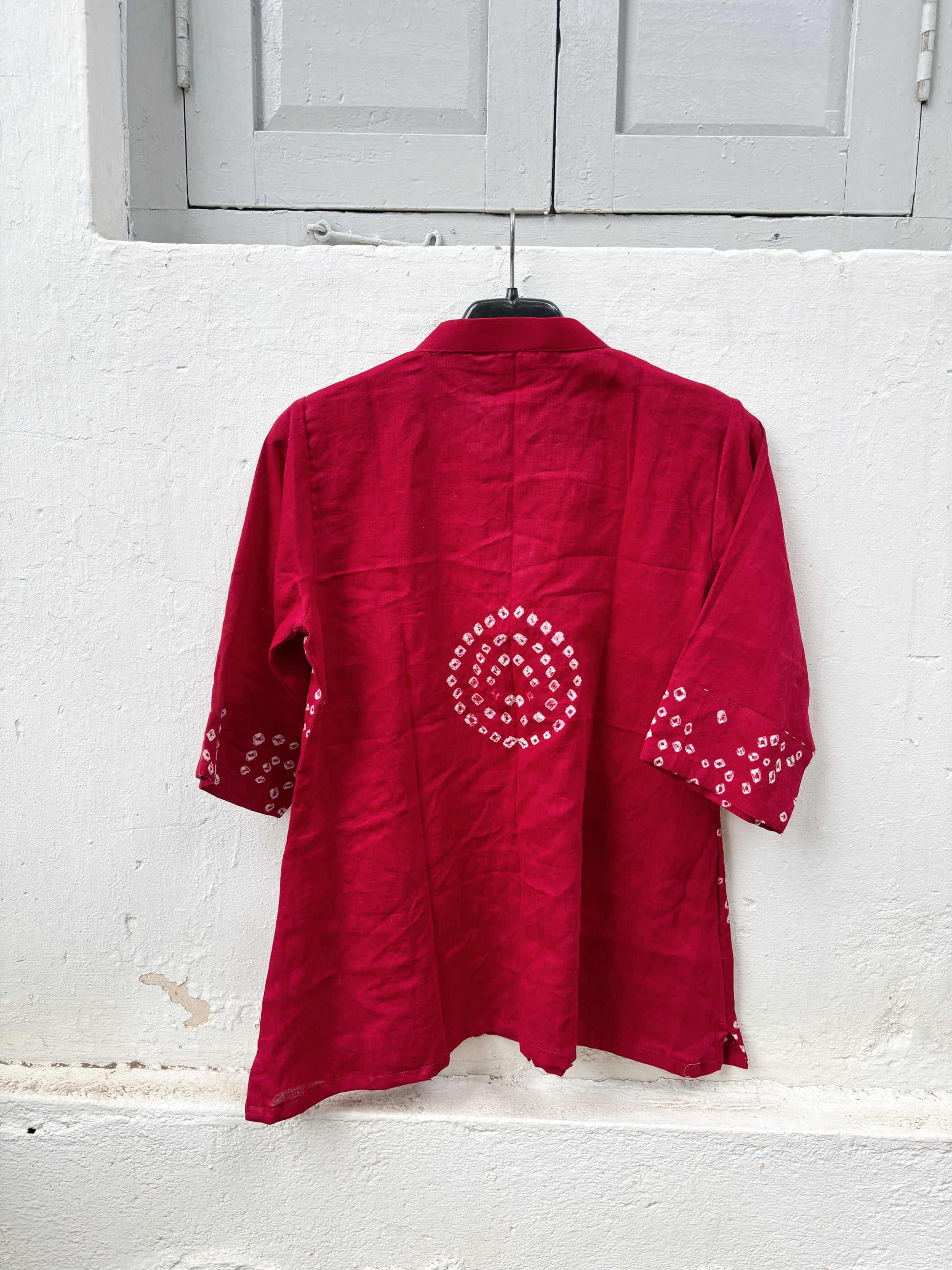 Kanku Dani red hand tie dyed Bandhani cotton satin shirt with soft mandarin collar and relaxed fit for women