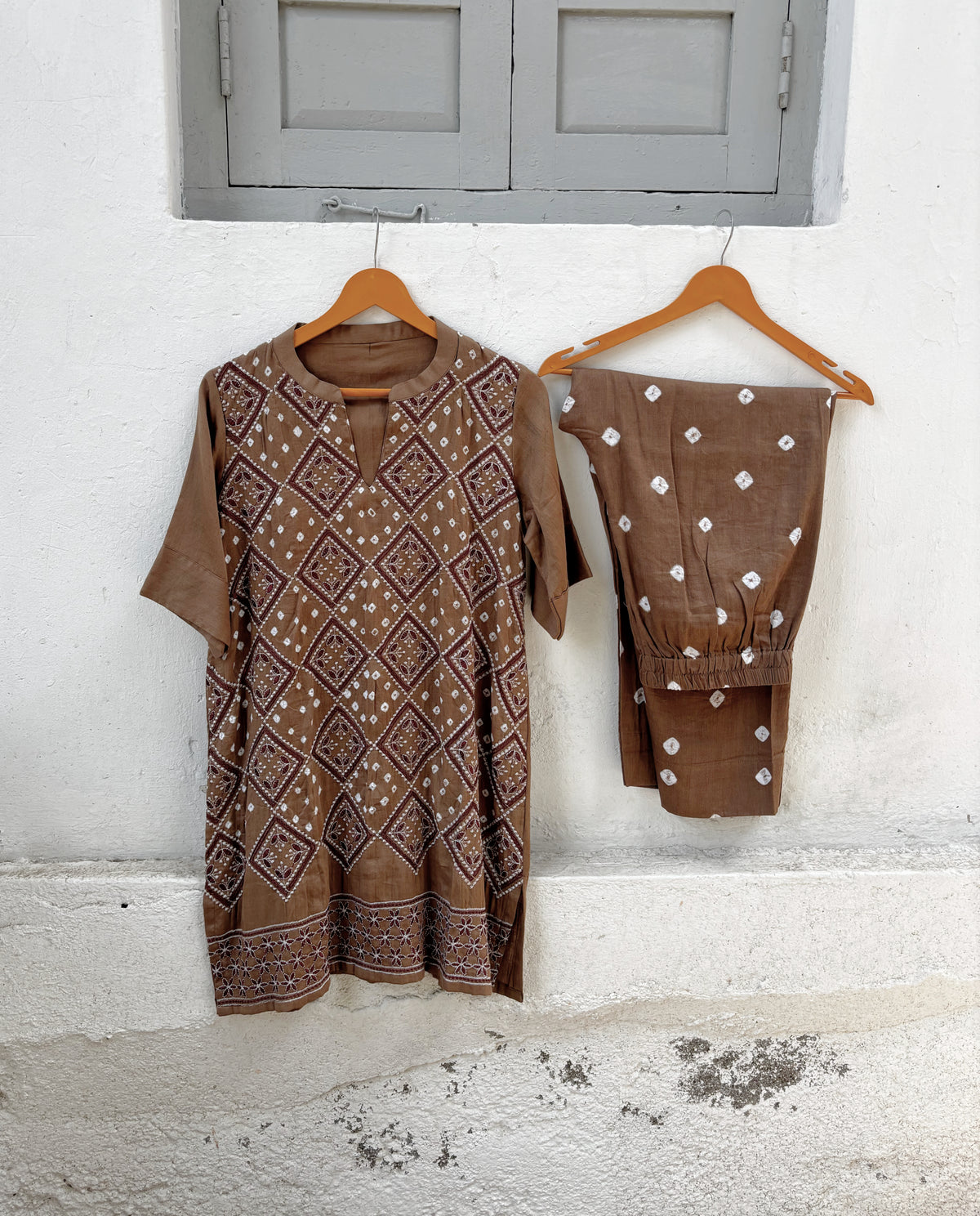 Kasturi brown Bandhani kurta and matching pants with white hand tie-dyed Rai Bandhani motifs
