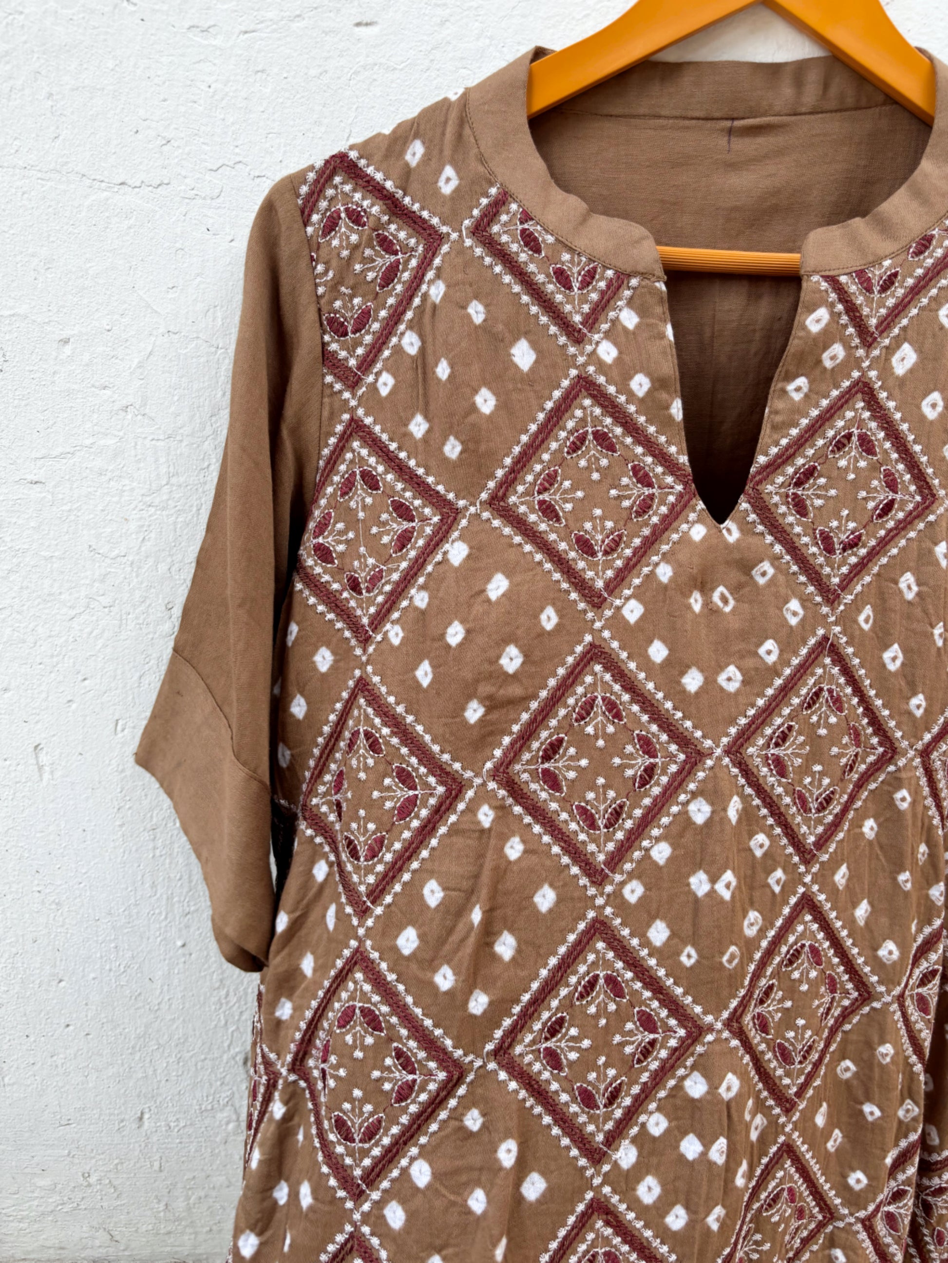 Kasturi light brown Bandhani kurta with geometric machine embroidery and white Rai Bandhani motifs
