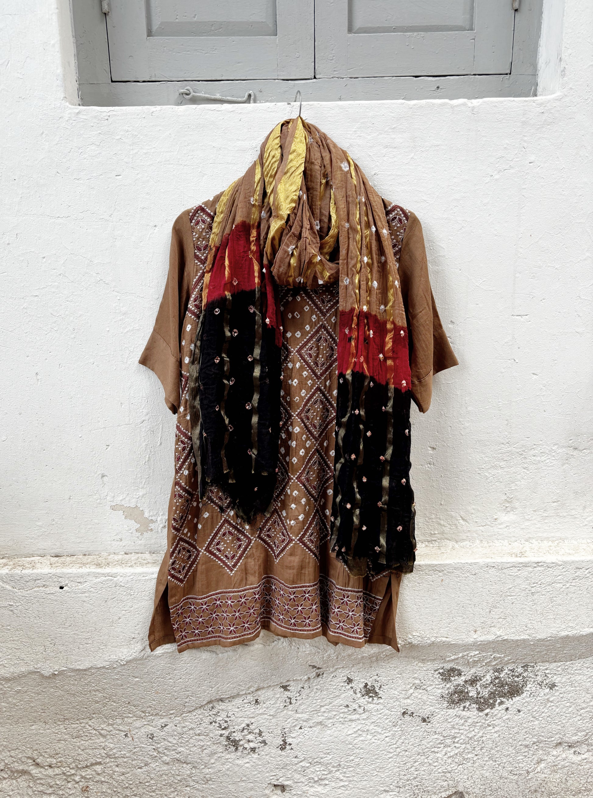 Kasturi three-piece brown Bandhani coord set with embroidered kurta, matching pants and tricolour dupatta
