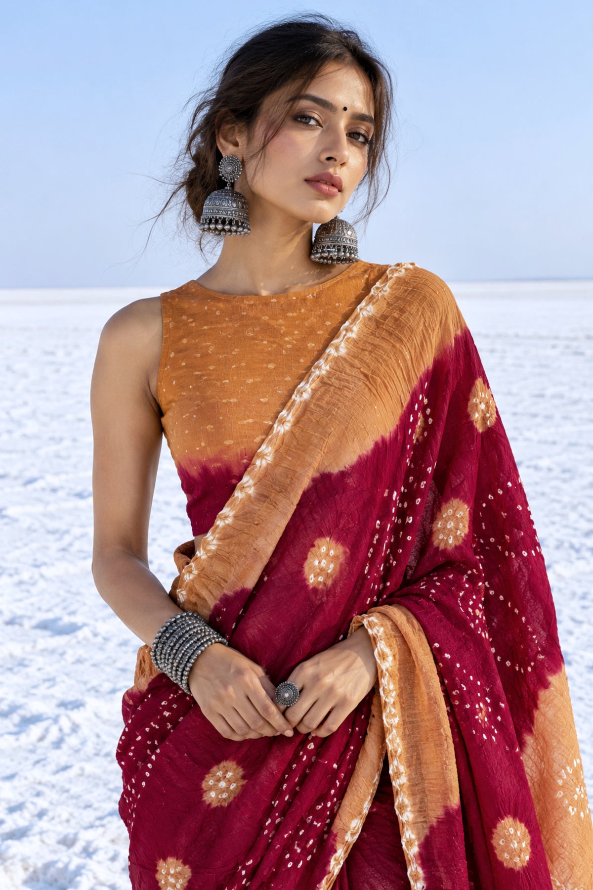Kasturi Gul hand tie-dyed Bandhani cotton saree in camel brown and deep wine maroon with white geometric and floral motifs
