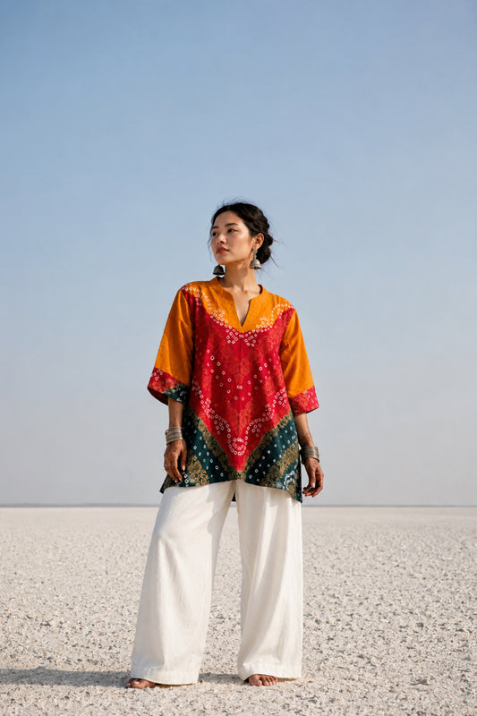 Handcrafted Bandhani festive cotton top in Saffron Yellow, Crimson Red and Deep Teal with antique gold woven floral motifs, mandarin V-neck, relaxed fit and three-quarter sleeves.