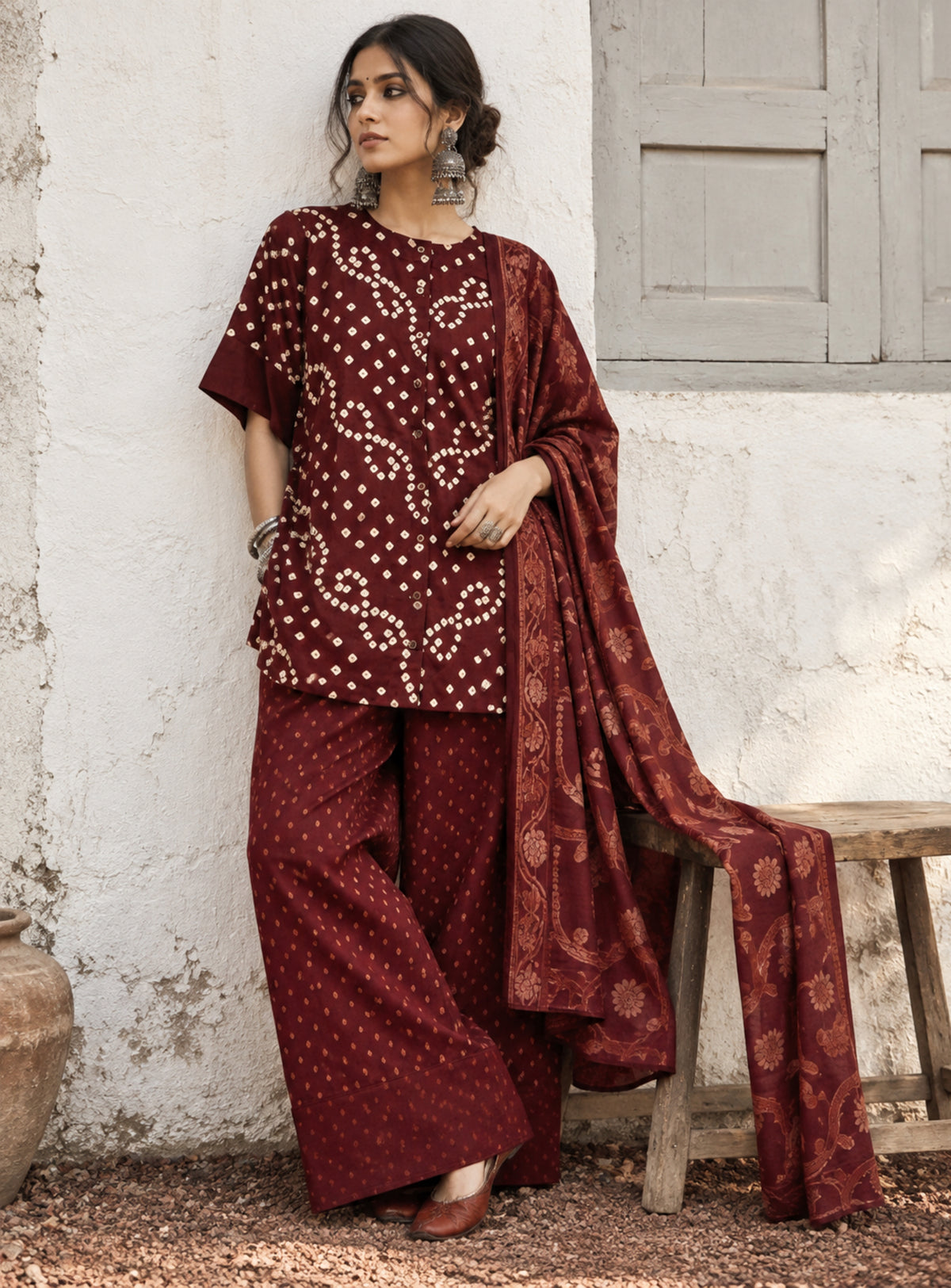 Kokum deep wine-red Bandhani shirt with ivory motifs, woven Farshi pants and floral patterned dupatta