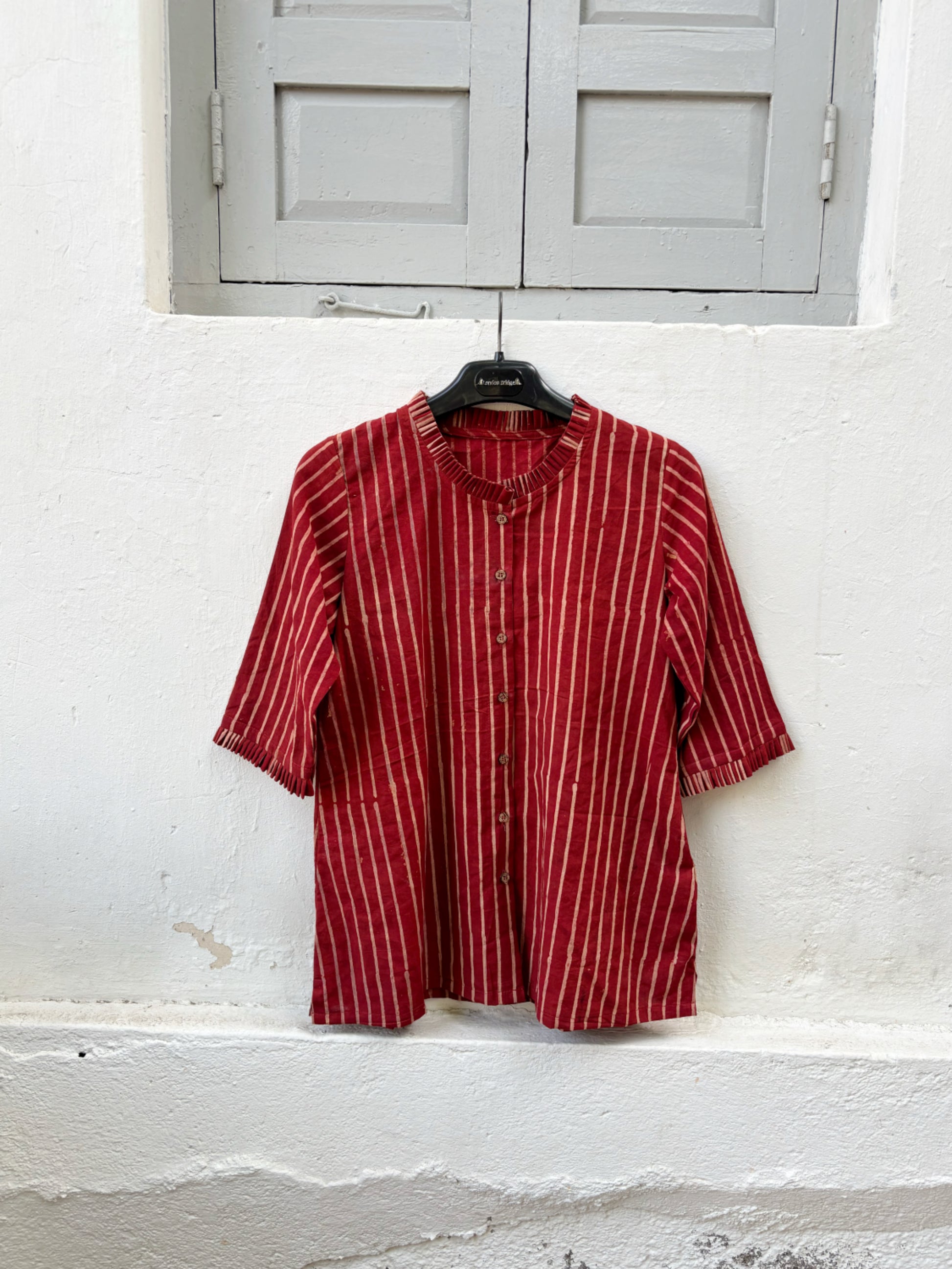 Natural dyed red Ajrakh hand block printed striped cotton shirt for women with pleated neckline and relaxed fit