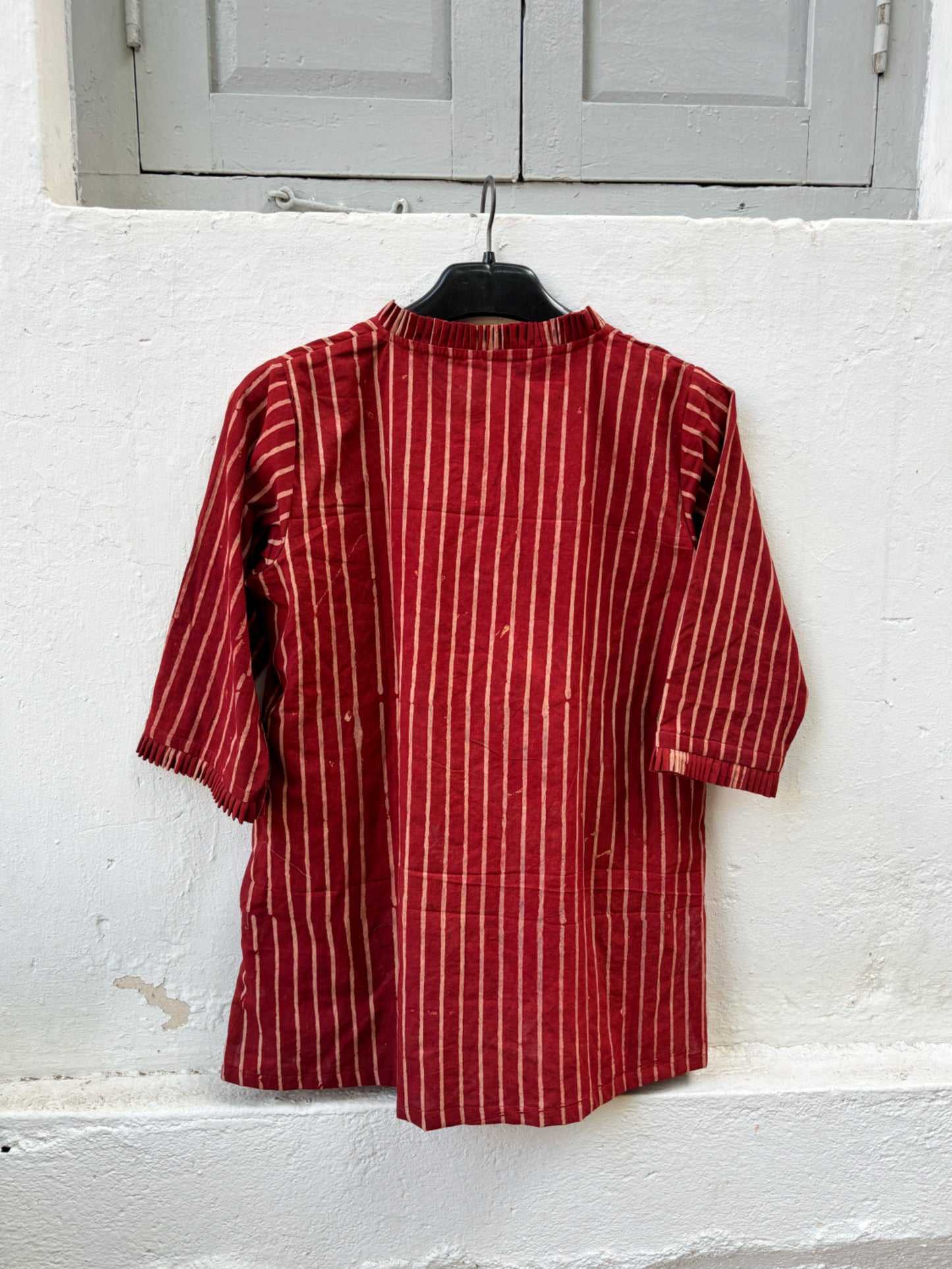 Natural dyed red Ajrakh hand block printed striped cotton shirt for women with pleated neckline and relaxed fit