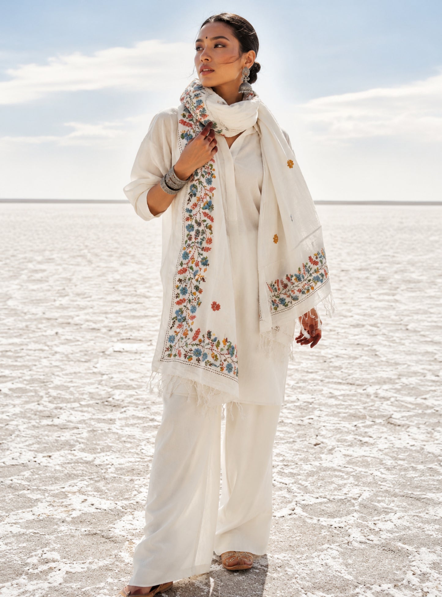 Maalti hand spun and handwoven off-white cotton dupatta with powder blue, coral, mustard, and olive floral embroidered borders, scattered floral butis, and handcrafted tassels.