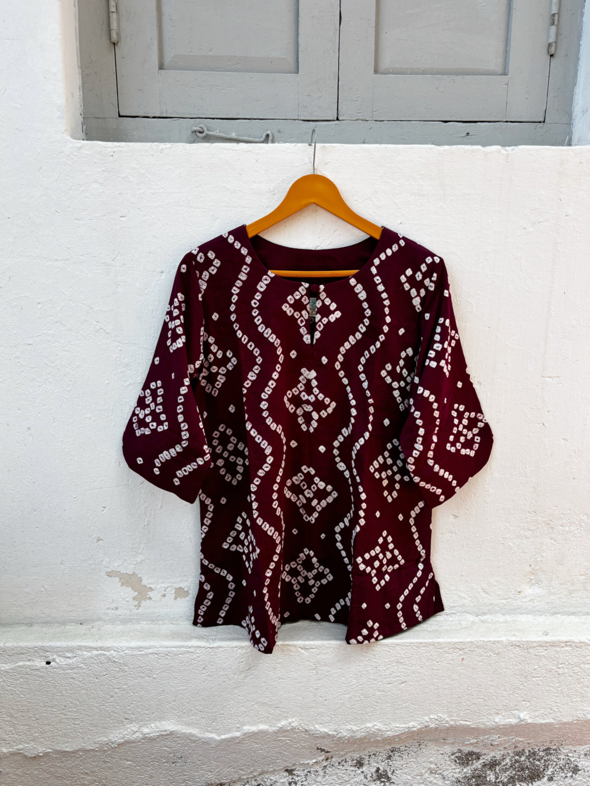 Madhur deep wine-plum cotton satin shirt with hand tie-dyed ivory Bandhani geometric patterns and round neckline.