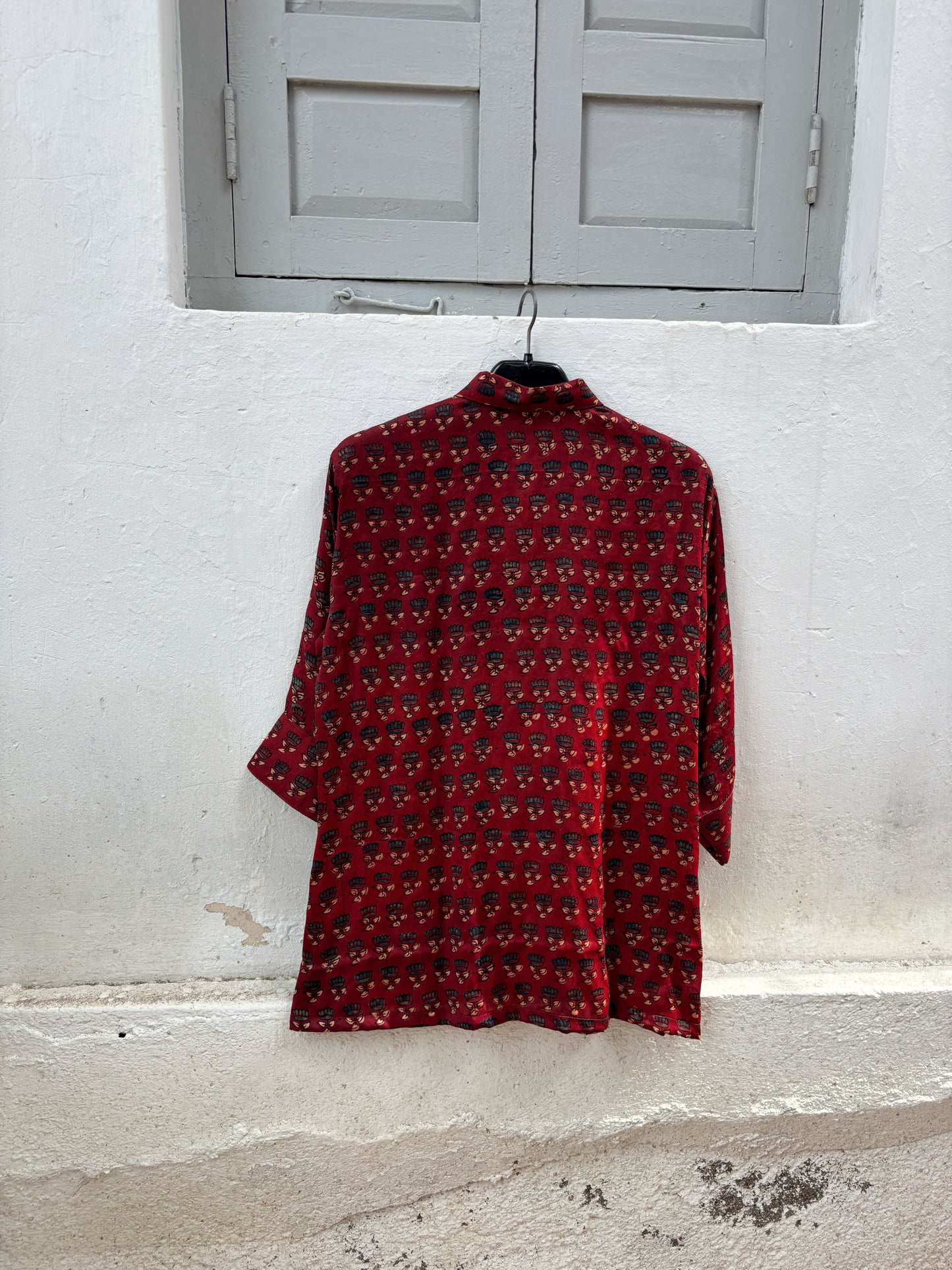 Natural dyed Ajrakh hand block printed modal silk relaxed shirt for women in deep madder red with delicate floral booti motifs.