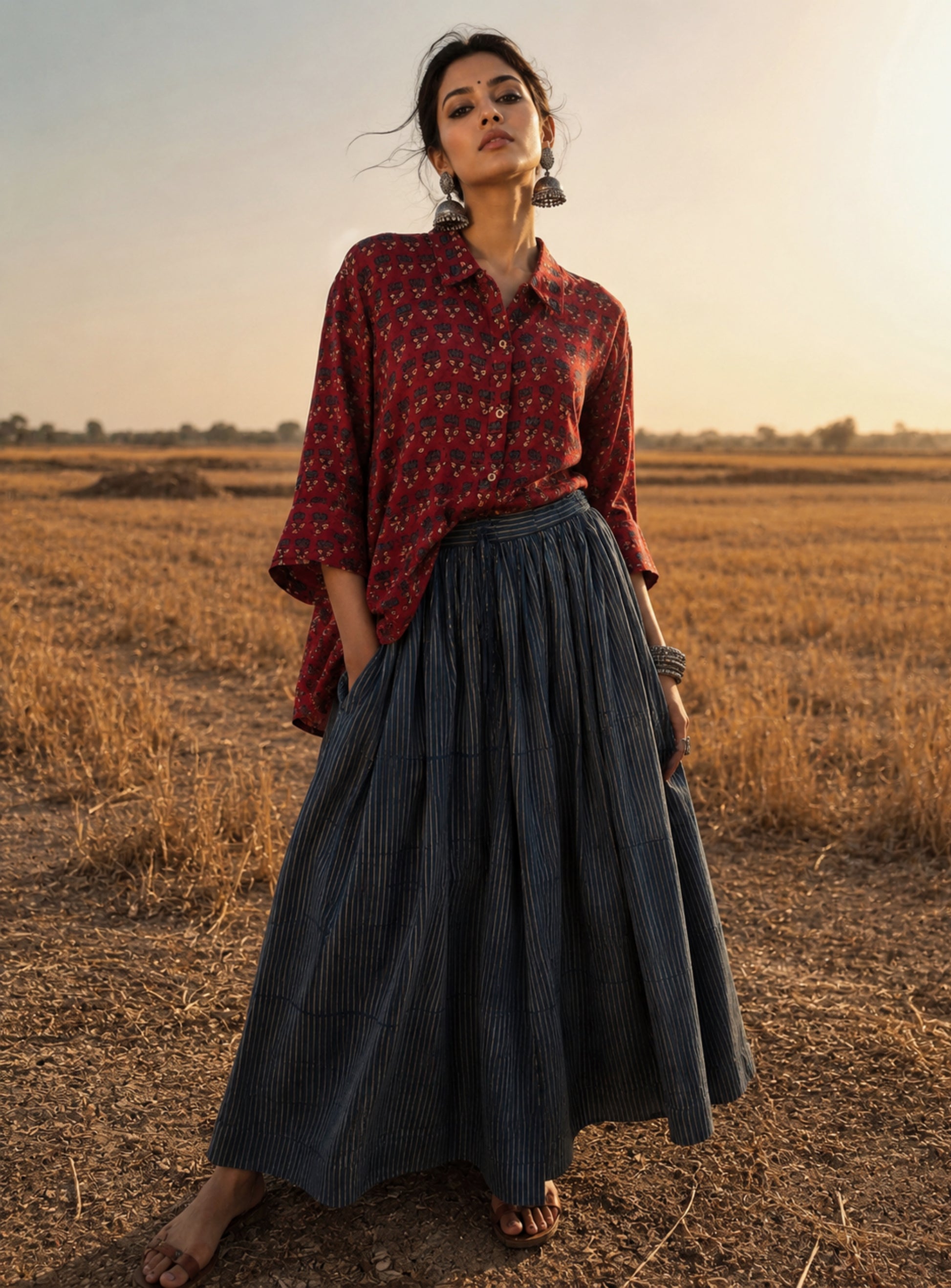 Natural dyed Ajrakh hand block printed modal silk relaxed shirt for women in deep madder red with delicate floral booti motifs.
