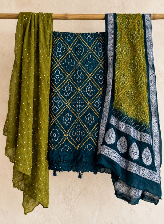 Three-piece modal silk Bandhani unstitched suit set in deep teal and olive green with self-thread woven dupatta borders