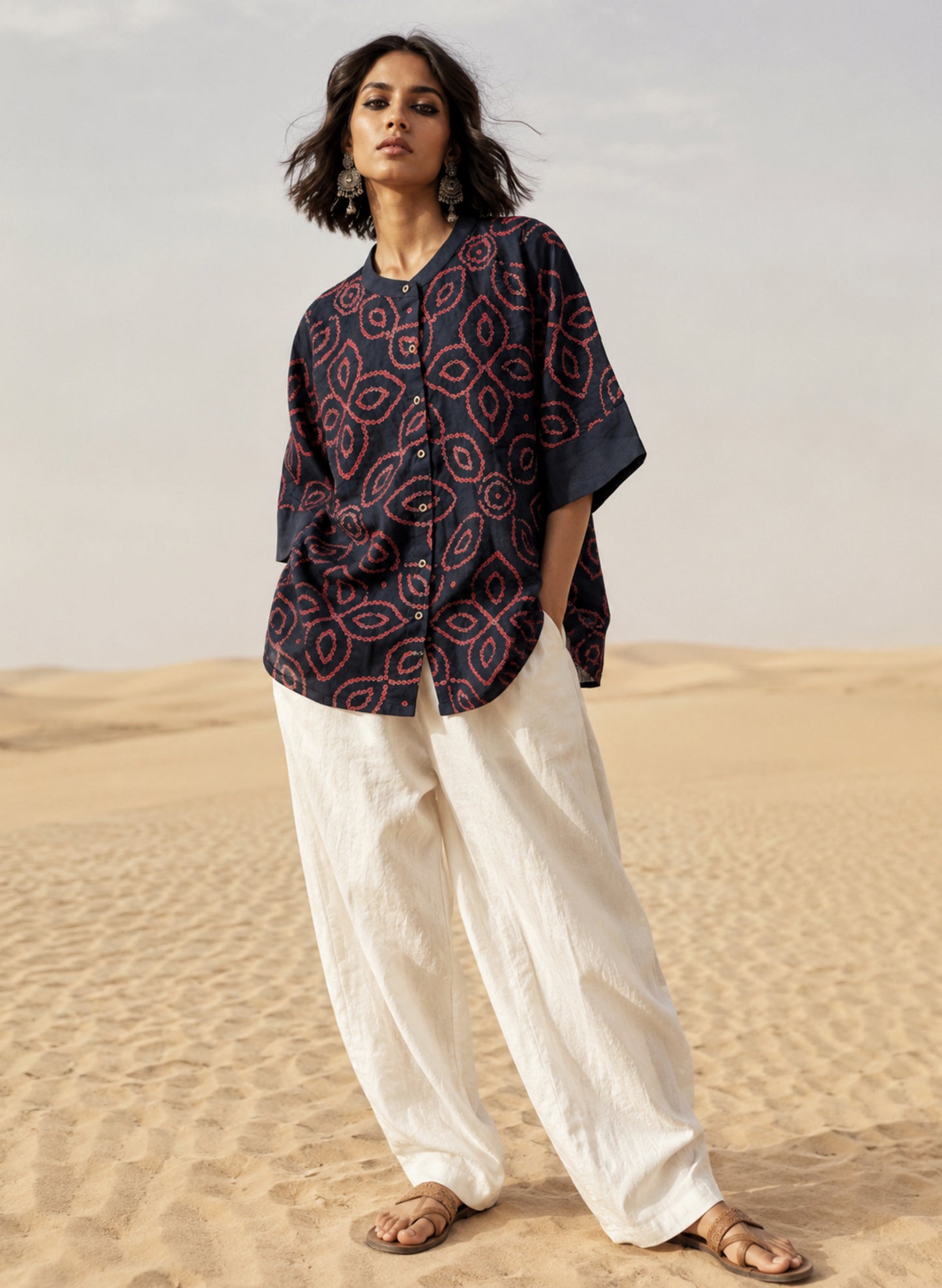 Midnight navy blue Jhankar Bandhani cotton shirt with raspberry rose floral motifs, soft mandarin collar, folded sleeve cuffs, coconut shell buttons and relaxed fit.