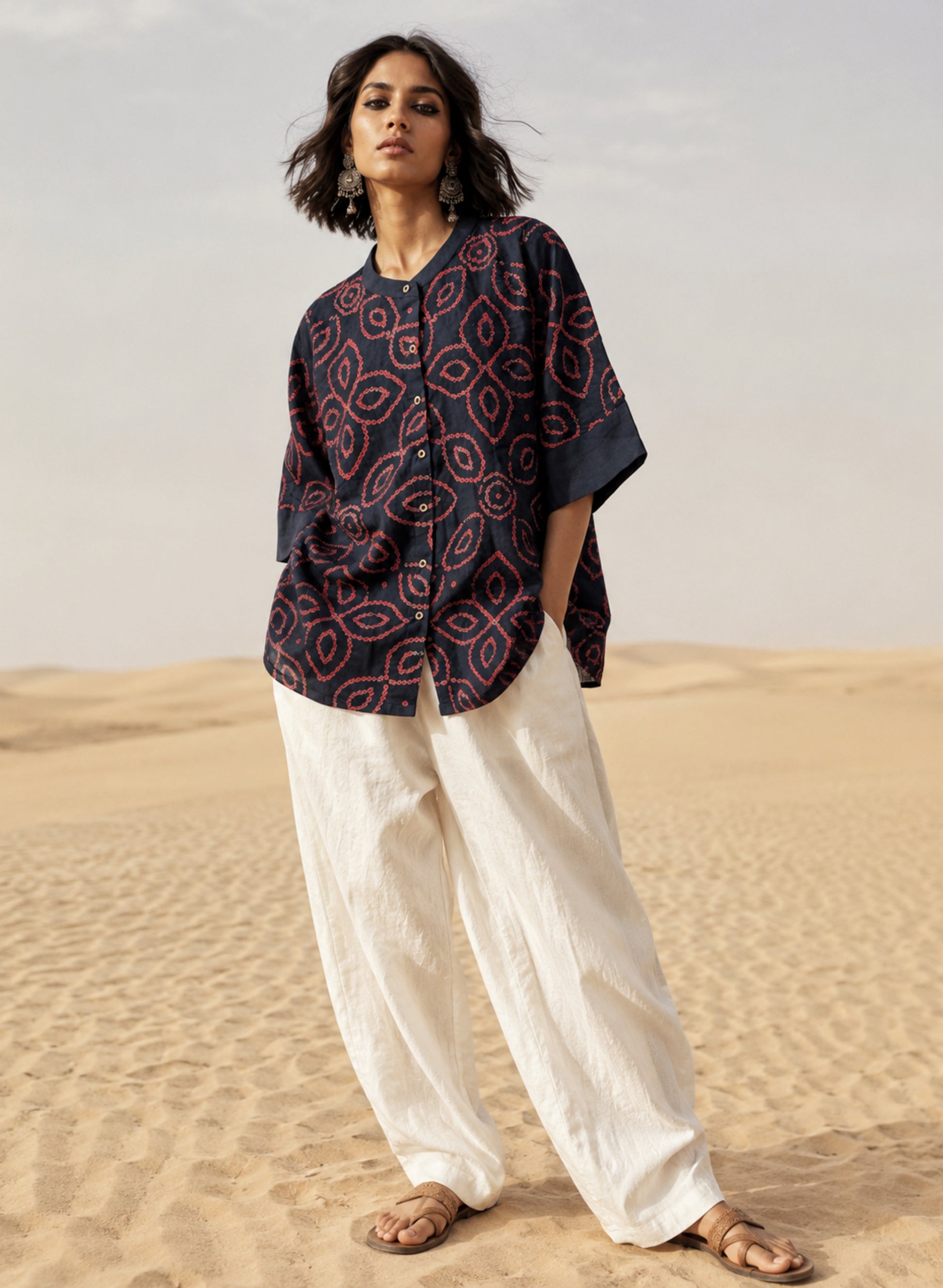 Midnight navy blue Jhankar Bandhani cotton shirt with raspberry rose floral motifs, soft mandarin collar, folded sleeve cuffs, coconut shell buttons and relaxed fit.