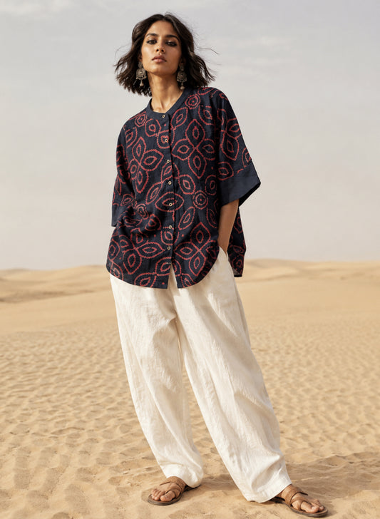 Midnight navy blue Jhankar Bandhani cotton shirt with raspberry rose floral motifs, soft mandarin collar, folded sleeve cuffs, coconut shell buttons and relaxed fit.