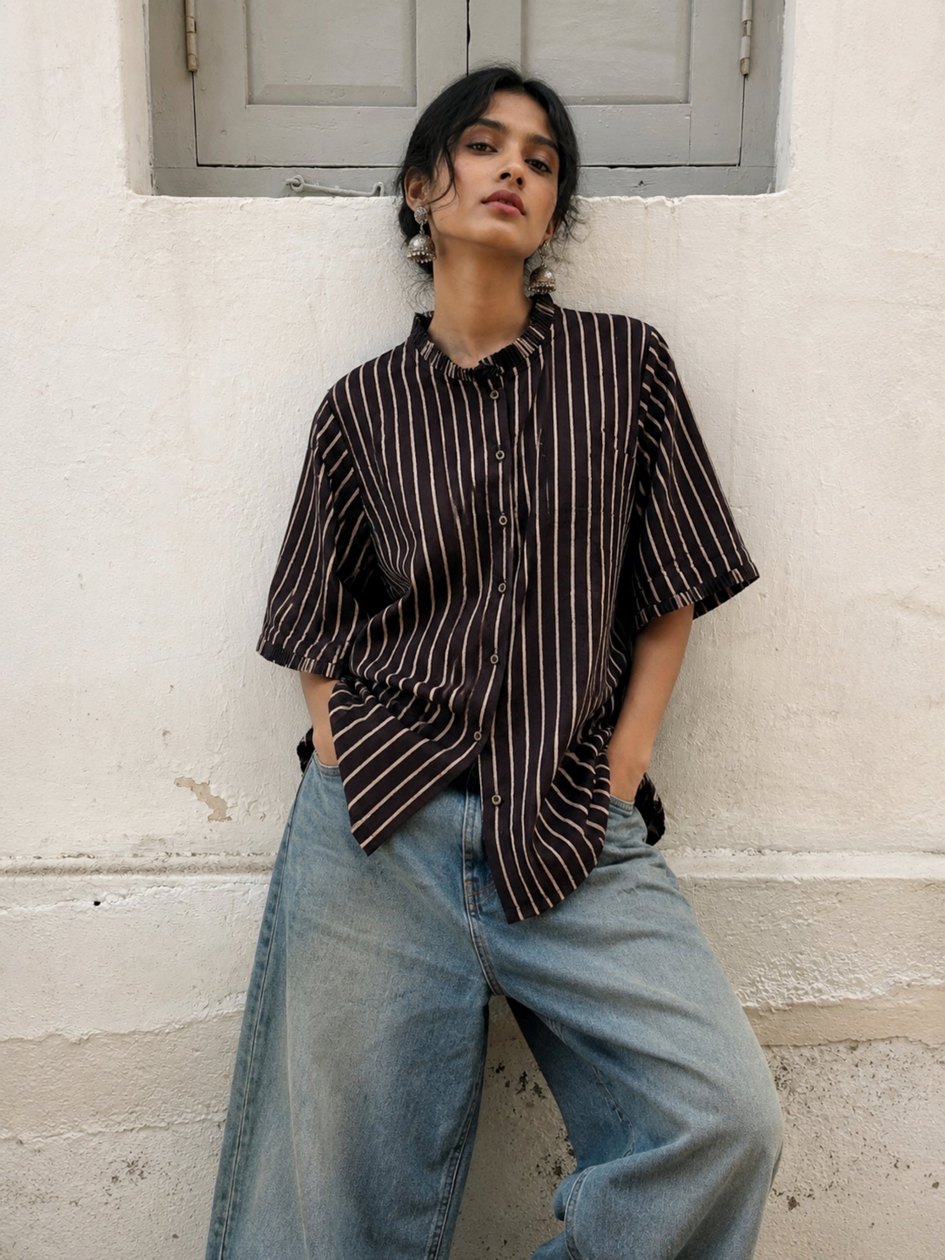 Ajrakh hand block printed cotton shirt with natural dyed beige stripes on a deep midnight base, pleated neckline, pleated sleeve hems and relaxed fit.
