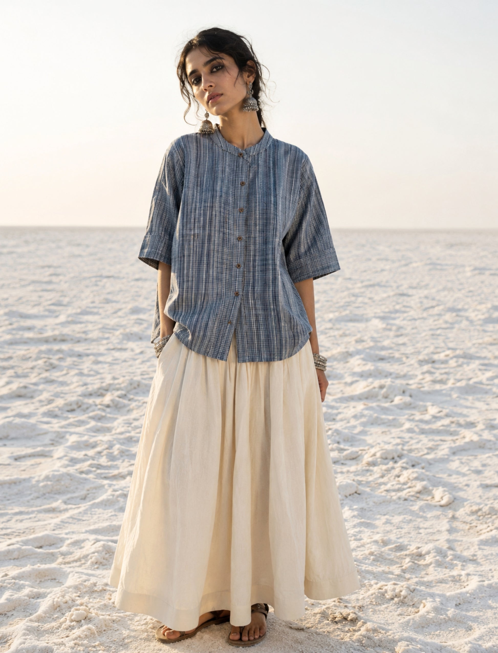 Hand spun handwoven cotton striped shirt in mist blue and ivory. Slow-made with a soft mandarin collar, relaxed fit and breathable woven texture.