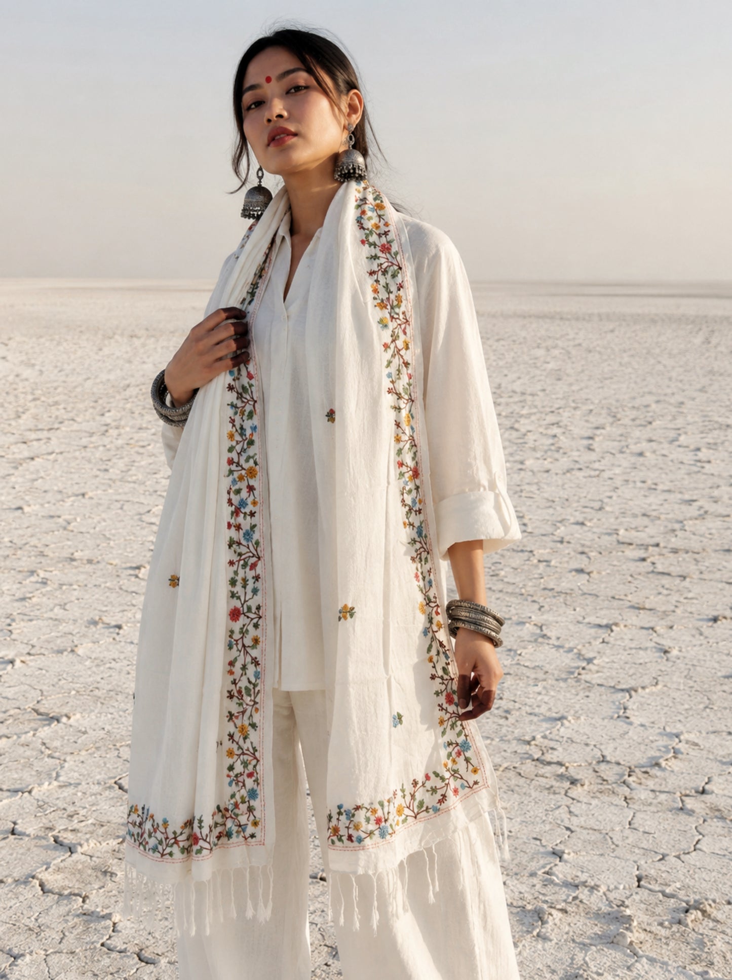 Mogra hand spun and handwoven off-white cotton dupatta with powder blue, coral, mustard, and olive floral embroidered borders, scattered floral butis, and handcrafted tassels.