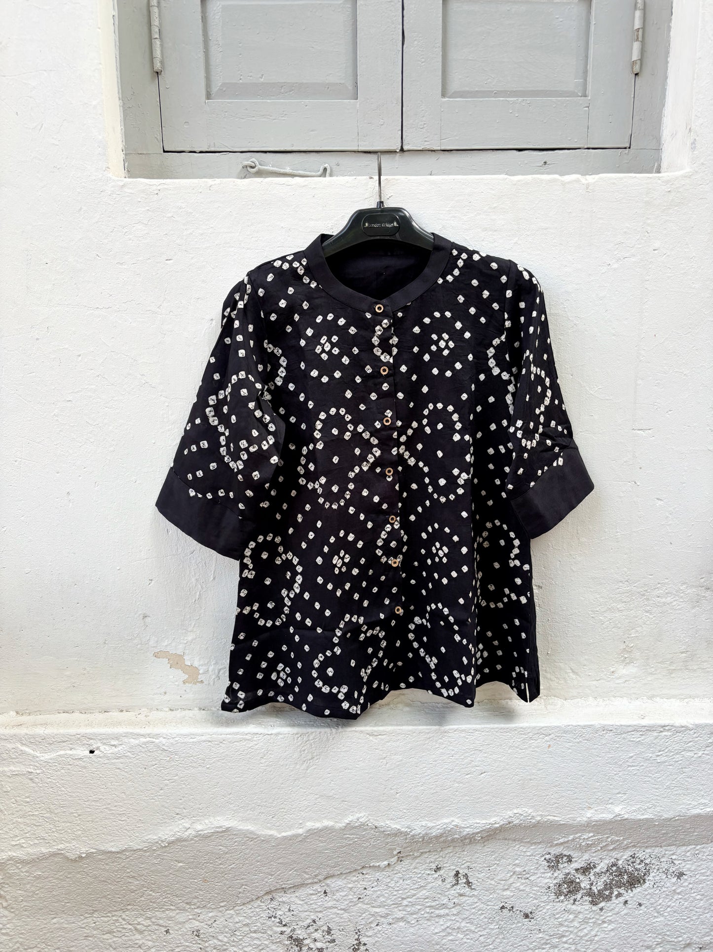Kali black cotton satin Bandhani shirt with ivory white hand tie-dyed motifs, mandarin collar, folded sleeve cuffs and relaxed fit