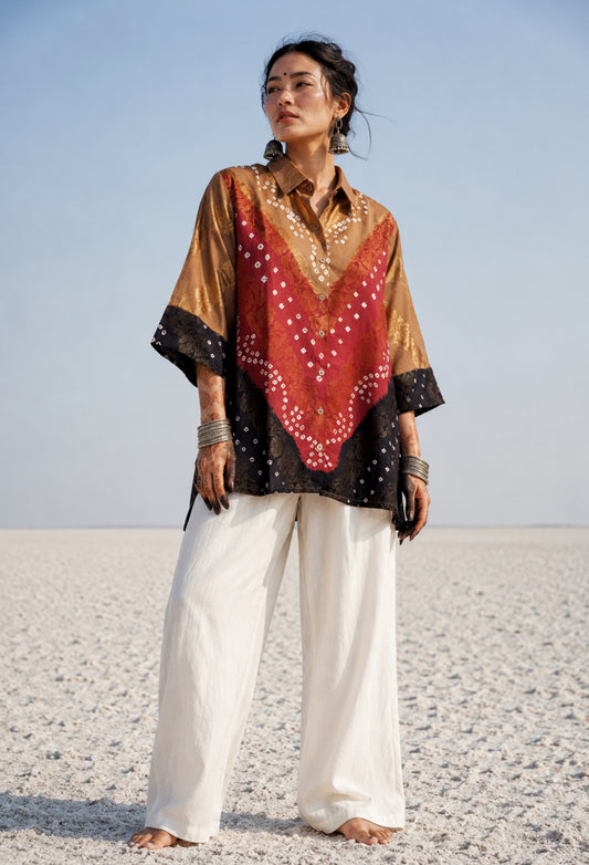 Handcrafted Bandhani festive cotton shirt in Earth Brown, Rustic Crimson and Classic Black with antique gold woven floral motifs, classic shirt collar, front button closure, relaxed fit and three-quarter sleeves.
