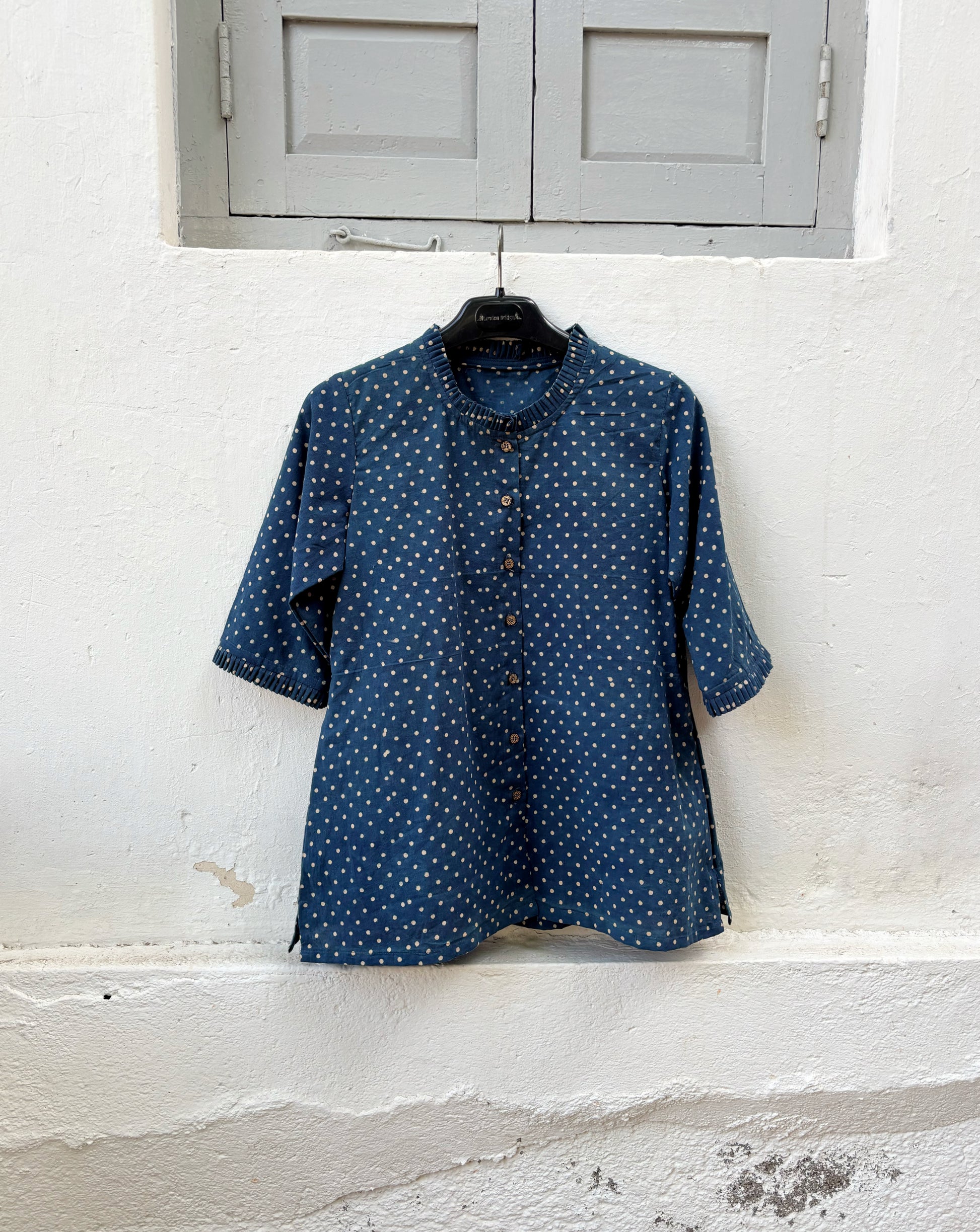 Indigo dyed hand block printed cotton shirt for women with dotted print, pleated neckline and relaxed fit