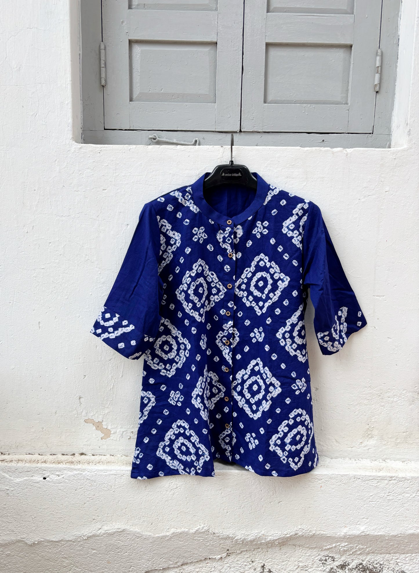 Neelva Dani royal blue hand tie dyed Bandhani cotton satin shirt with soft mandarin collar and relaxed fit for women.