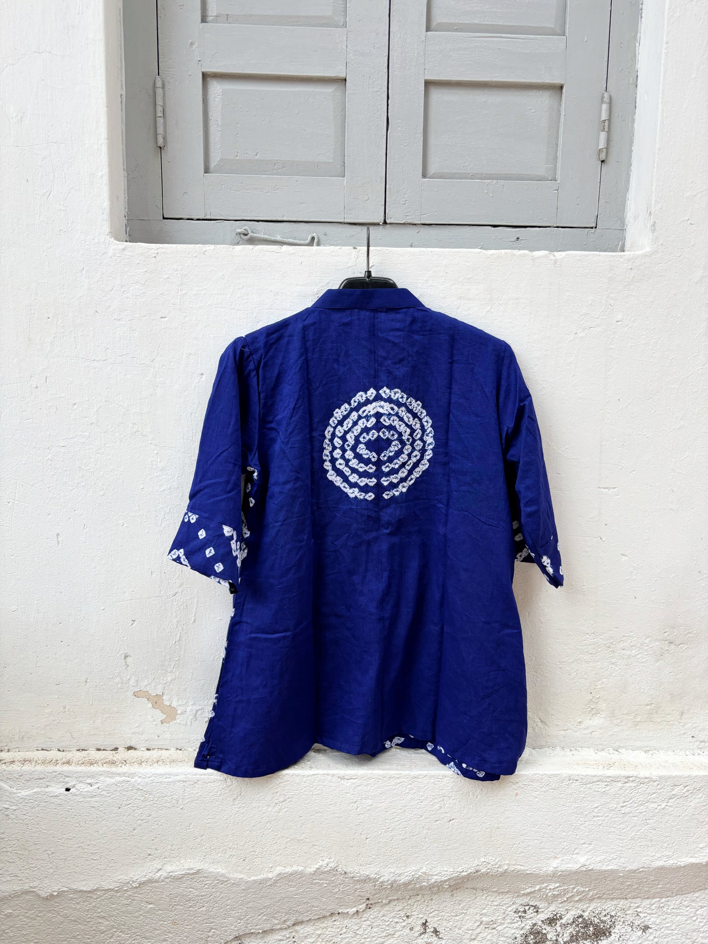 Neelva Dani royal blue hand tie dyed Bandhani cotton satin shirt with soft mandarin collar and relaxed fit for women.