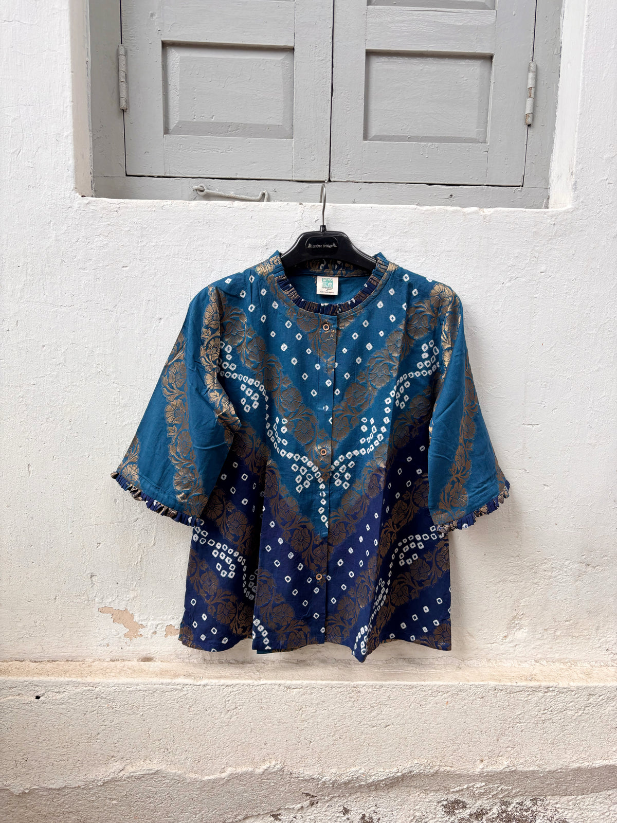 Neeravi festive Bandhani cotton shirt in two shades of teal with ivory hand tie-dyed Bandhani, antique-gold Banarasi floral weave and pleated neckline