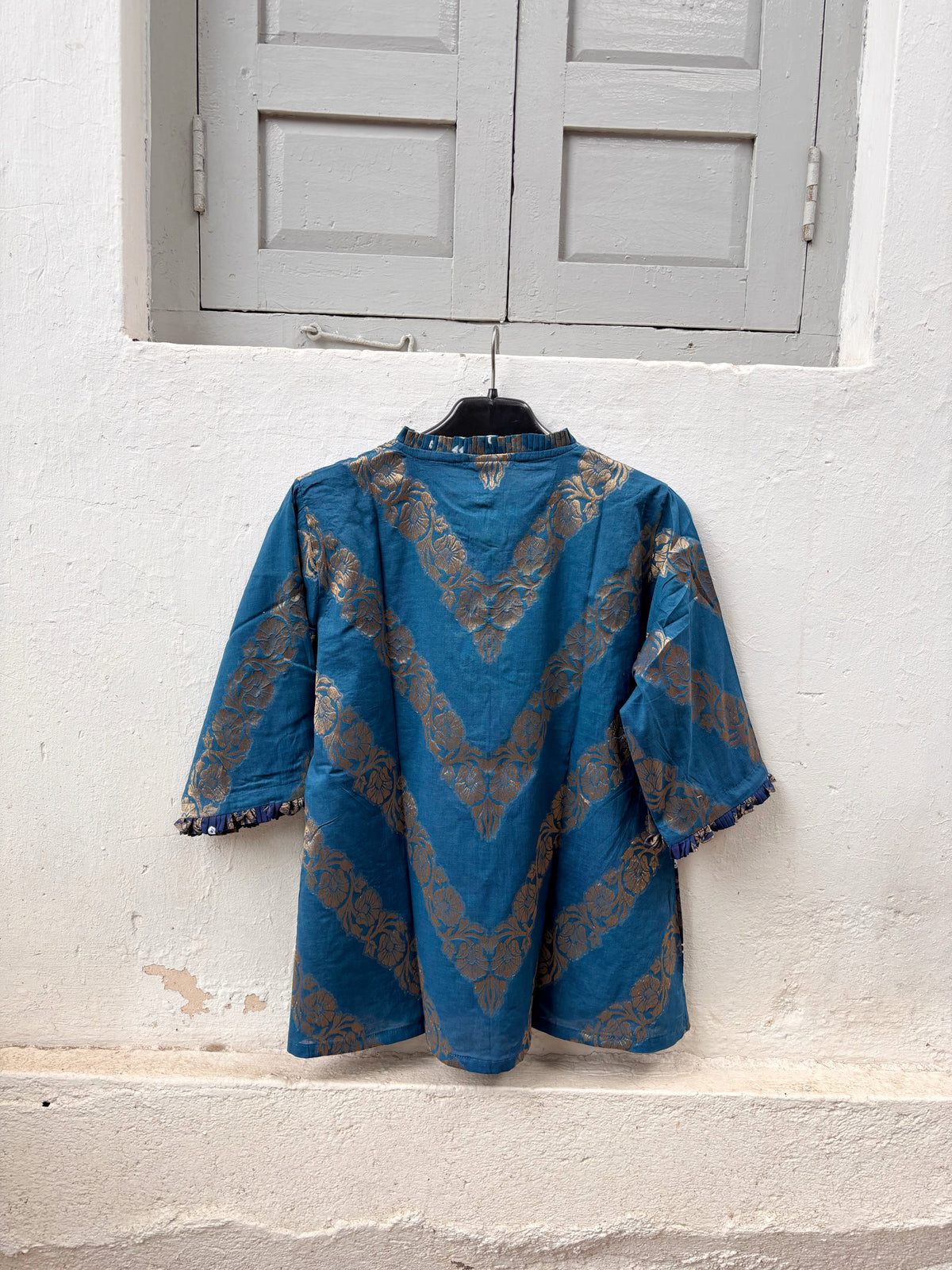 Neeravi festive Bandhani cotton shirt in two shades of teal with ivory hand tie-dyed Bandhani, antique-gold Banarasi floral weave and pleated neckline
