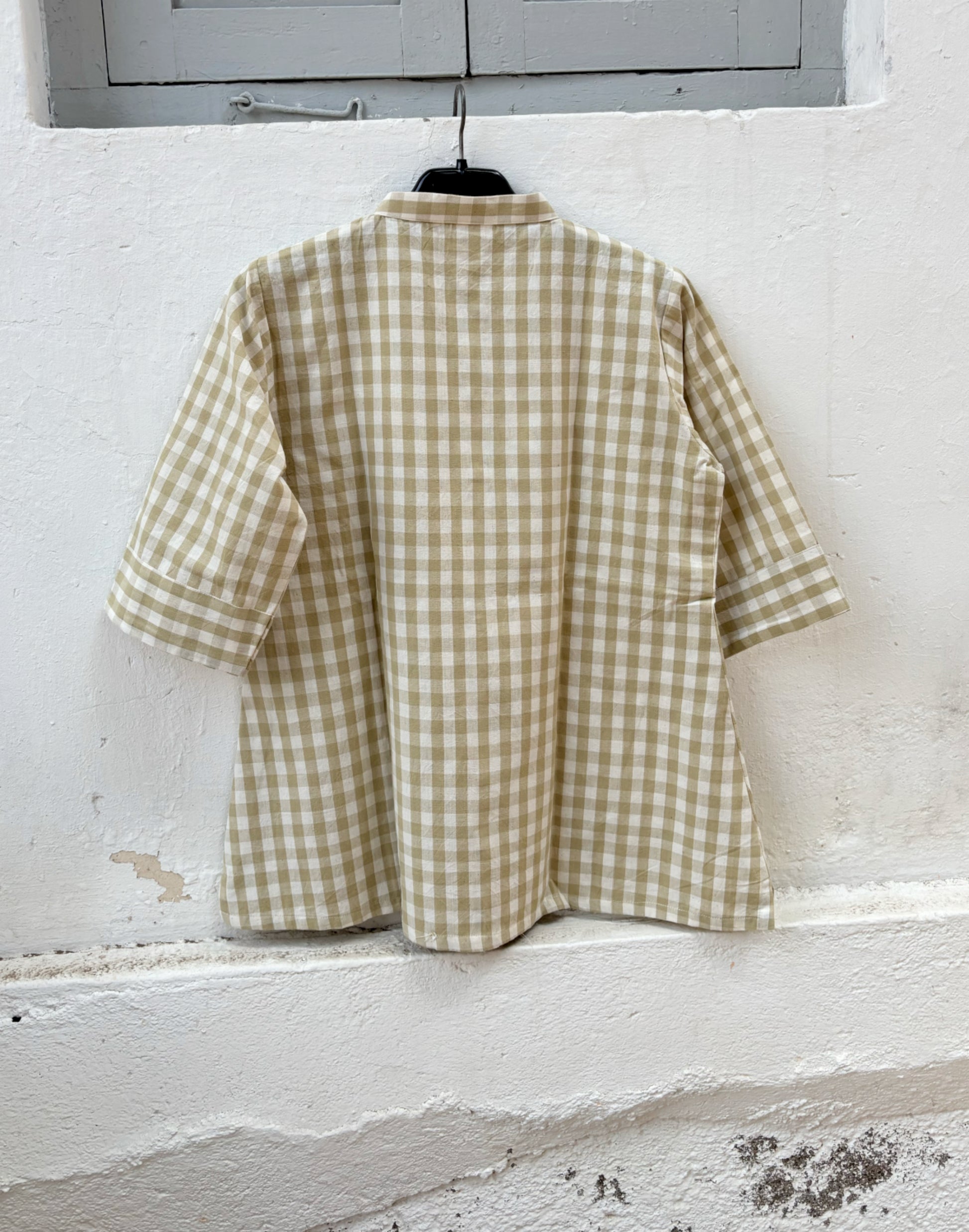 Olive Meadow hand spun handwoven cotton checks shirt in earthy olive and natural ivory gingham with a soft mandarin collar, wooden buttons and relaxed silhouette, paired with a raw undyed hand spun handwoven cotton skirt.