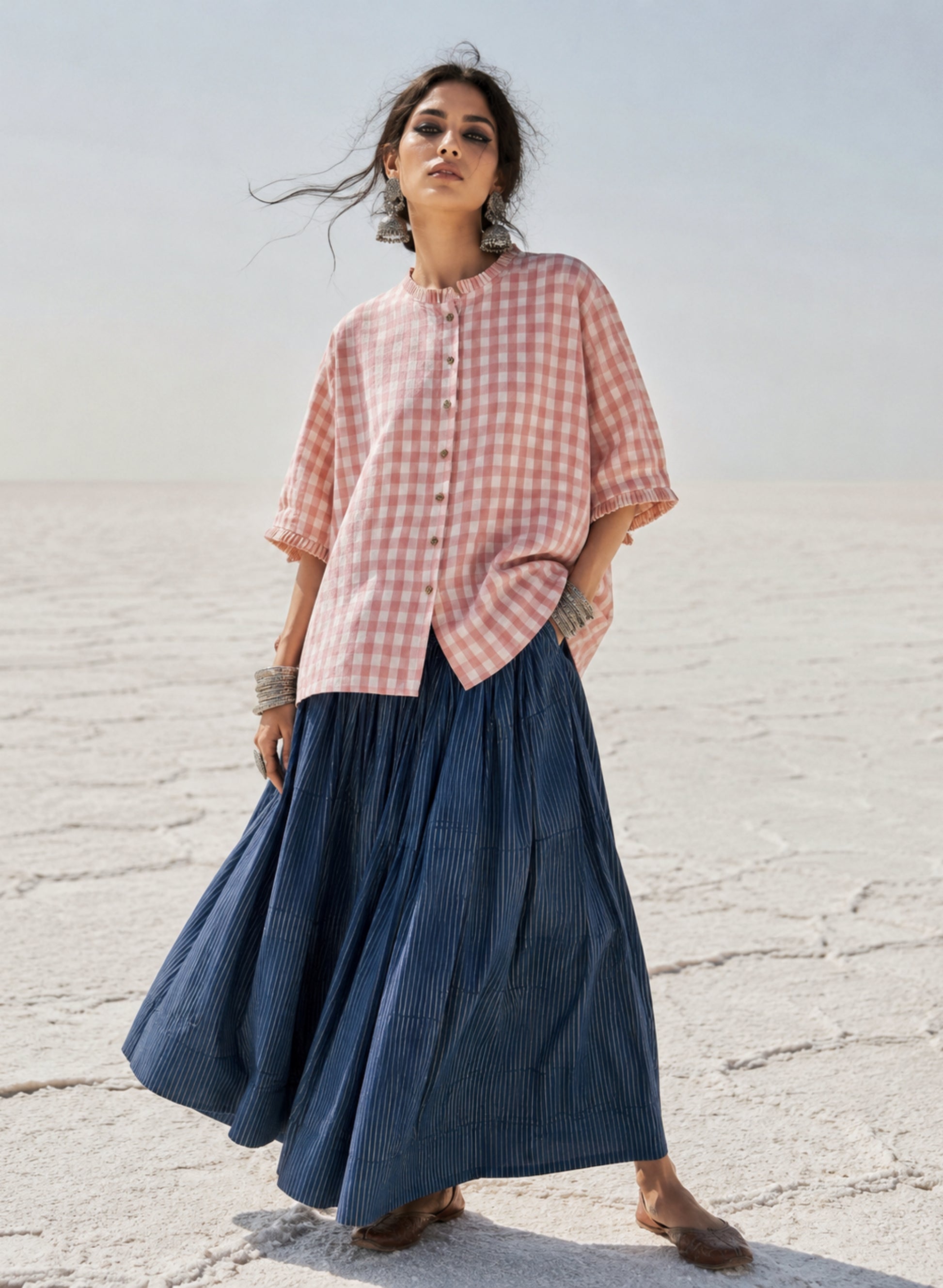 Peach Blush hand spun handwoven cotton checks shirt in pinkish peach and natural ivory with pleated neckline, pleated sleeve hems and wooden buttons.