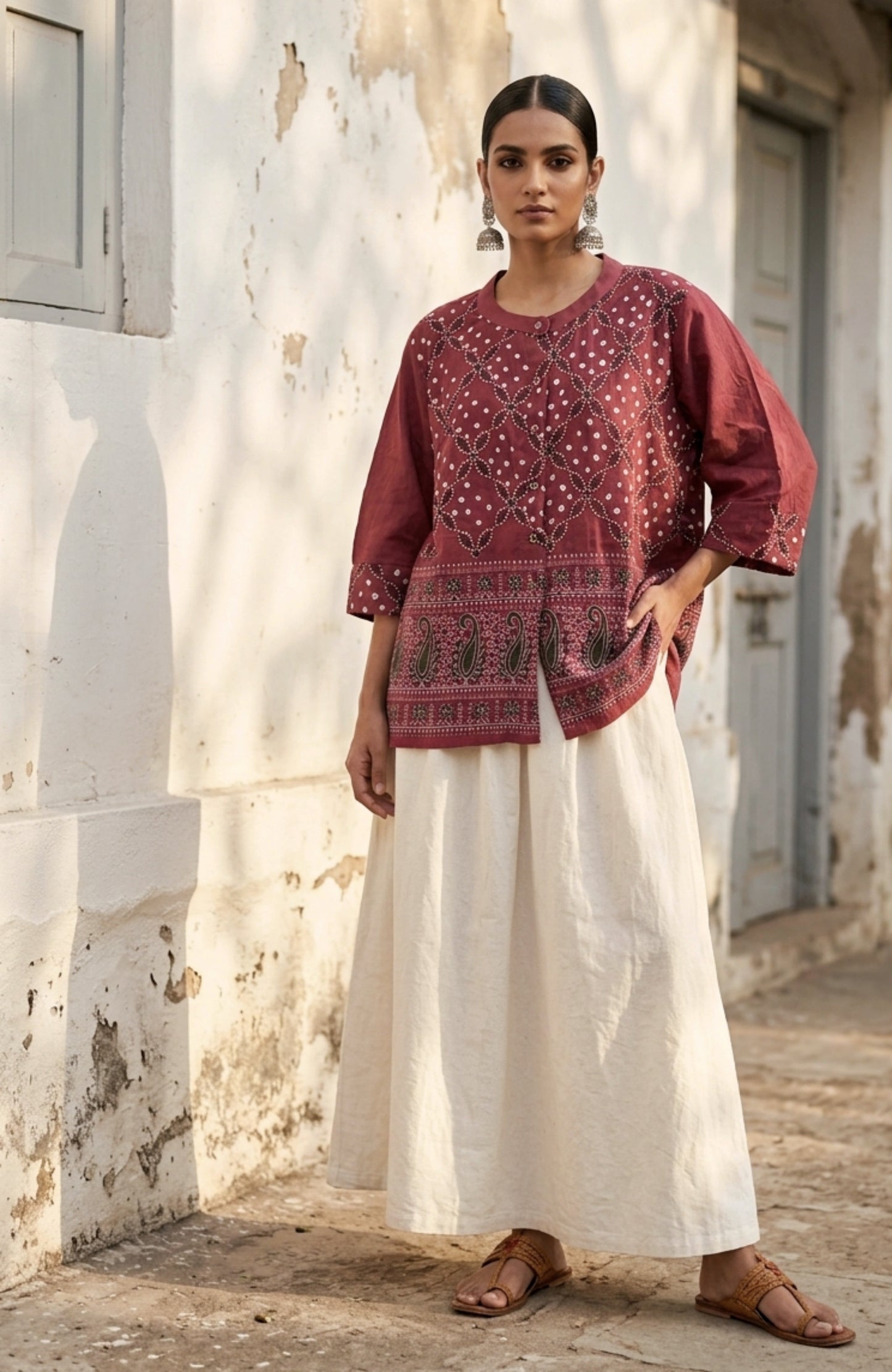 Dusty berry rose cotton satin Bandhani shirt with machine embroidery on the front panel and sleeve cuffs, soft mandarin collar and relaxed fit.