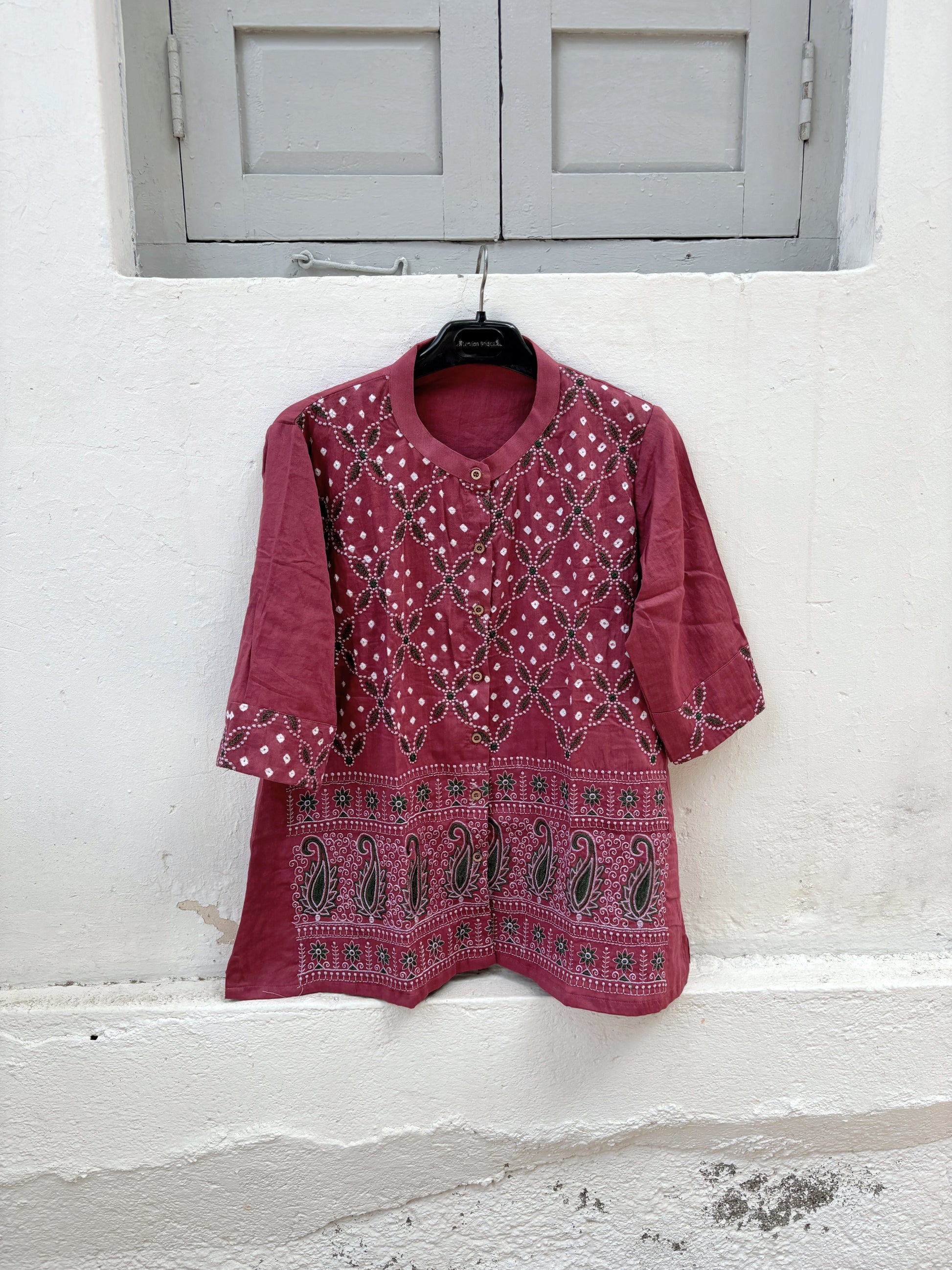 Dusty berry rose cotton satin Bandhani shirt with machine embroidery on the front panel and sleeve cuffs, soft mandarin collar and relaxed fit.