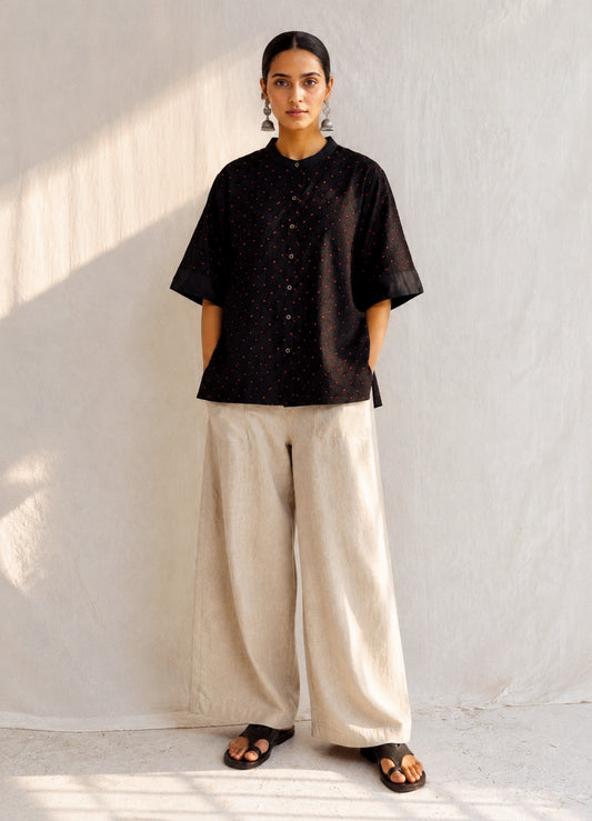 Black cotton satin shirt with colourful hand-tied thread knot detailing on the front, soft mandarin collar and plain back.