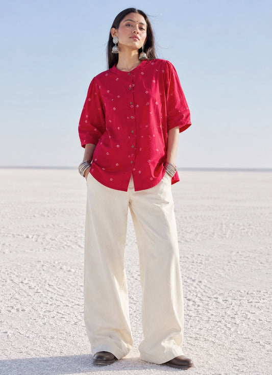 Relaxed fit raspberry pink Bandhani cotton shirt with wooden buttons.
