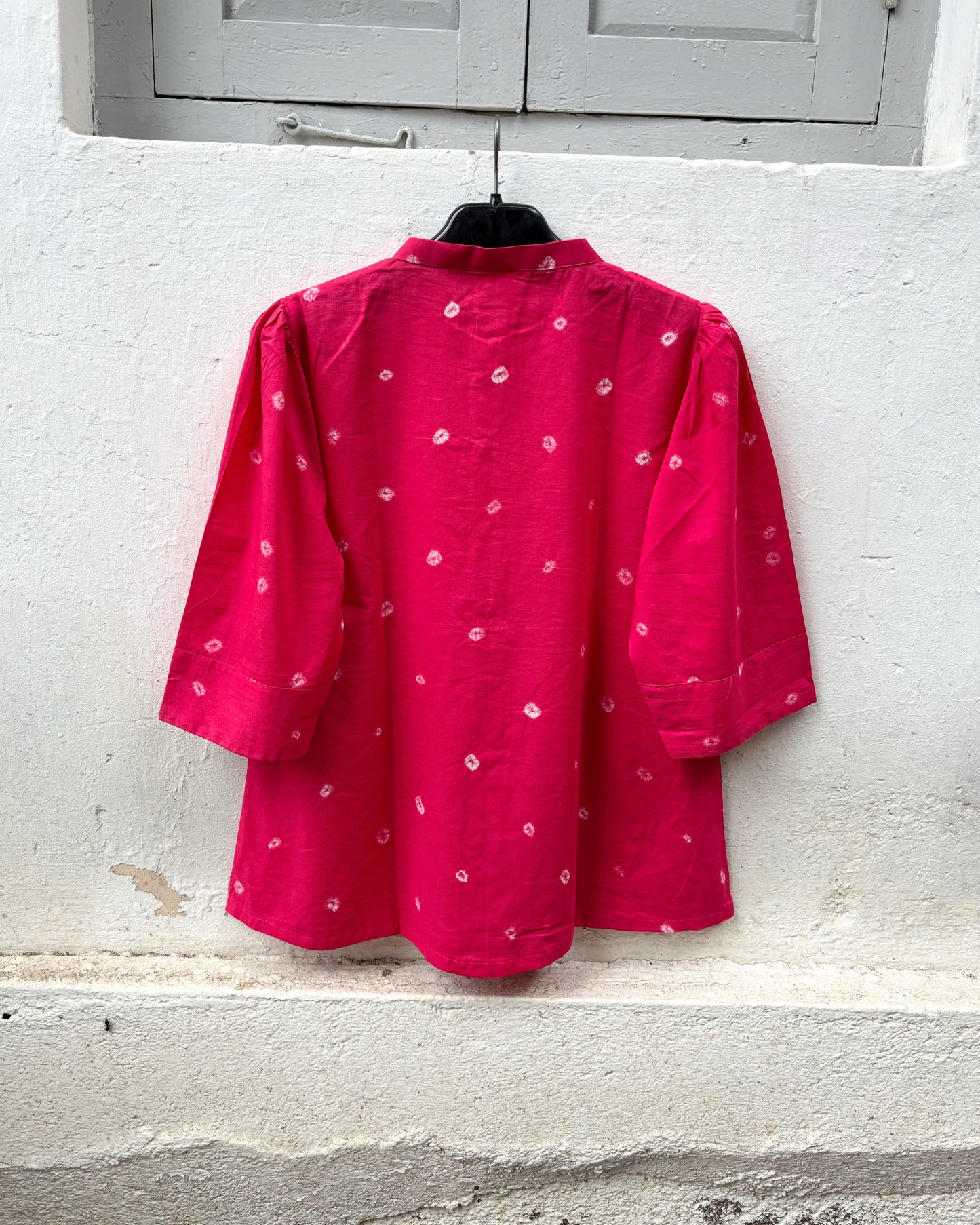 Raspberry pink hand tie-dyed Bandhani cotton shirt with a soft mandarin collar.
