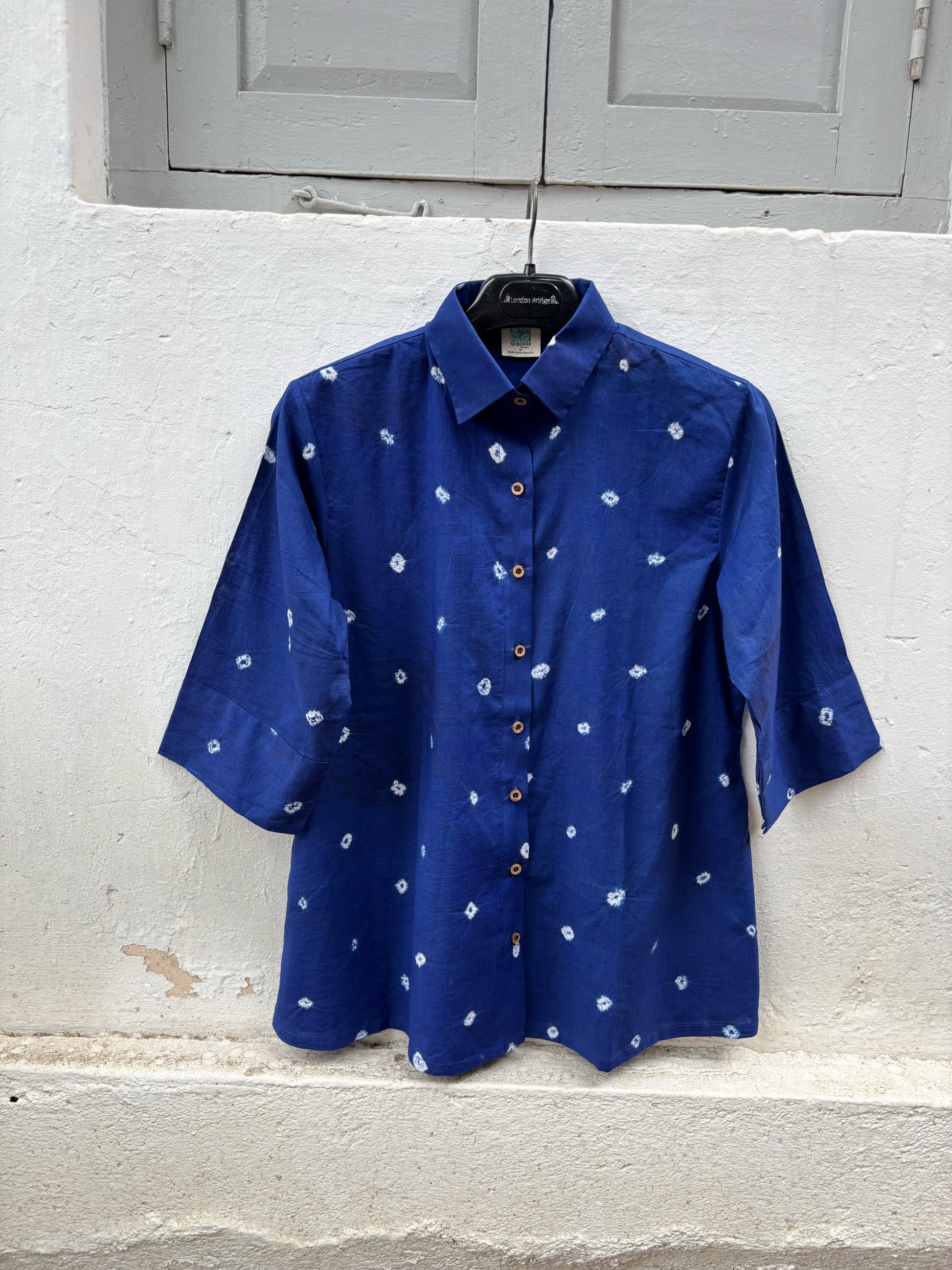 Women's regal blue cotton Bandhani shirt with wooden buttons.
