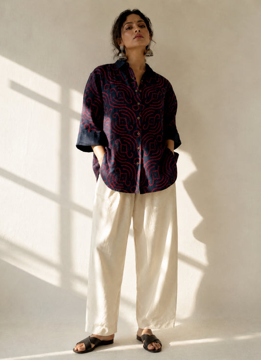 Midnight Blue hand tie-dyed Bandhani cotton shirt with vibrant Magenta motifs, classic shirt collar and relaxed fit from the Jhankar collection.
