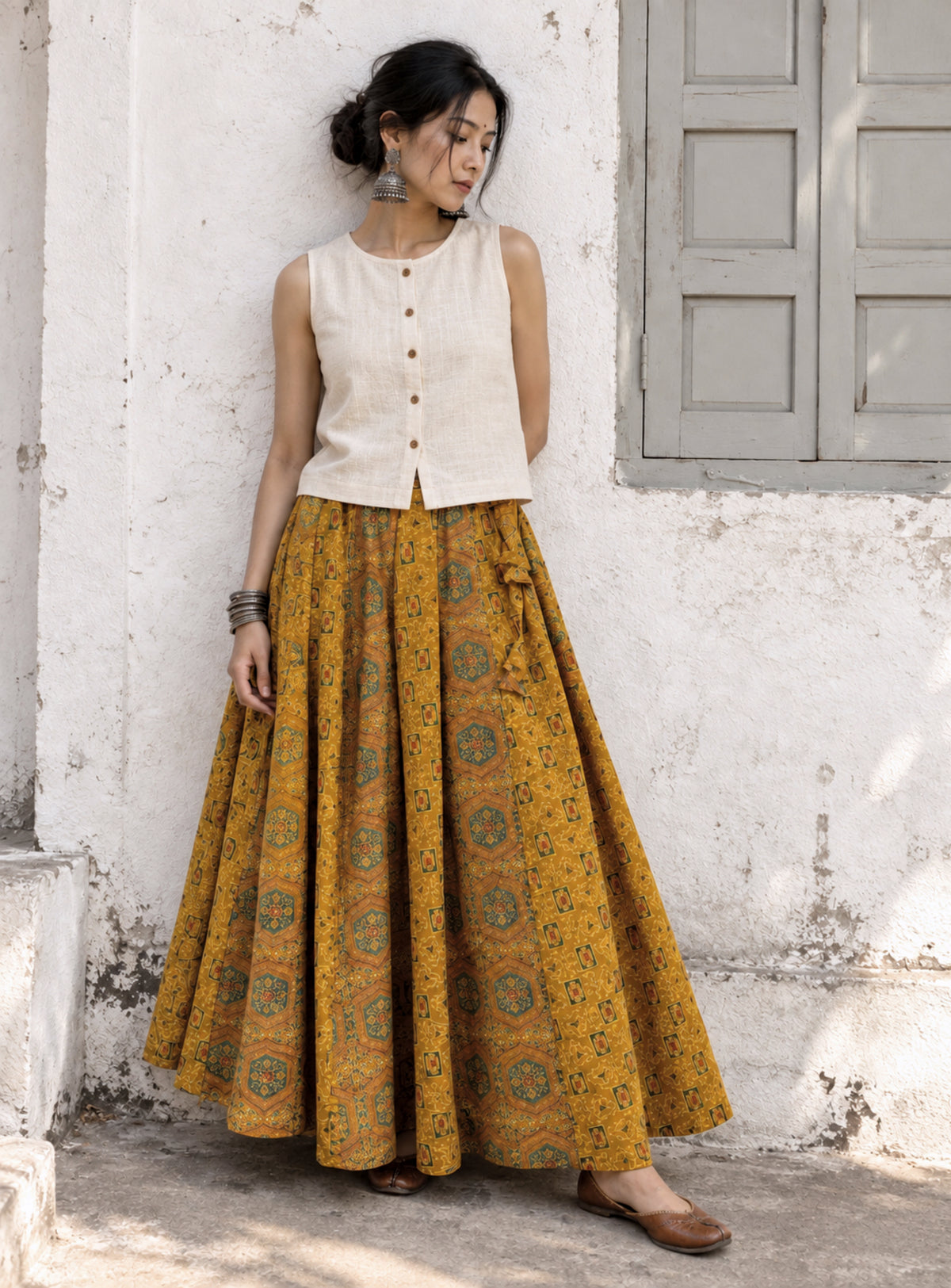 Sonajhuri turmeric-dyed Ajrakh cotton kali-cut skirt with hand block print