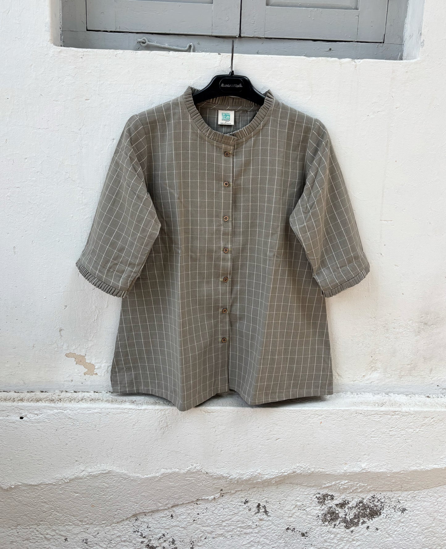 Stone grey hand spun handwoven cotton checks shirt with pleated neckline, pleated sleeve hems and relaxed fit