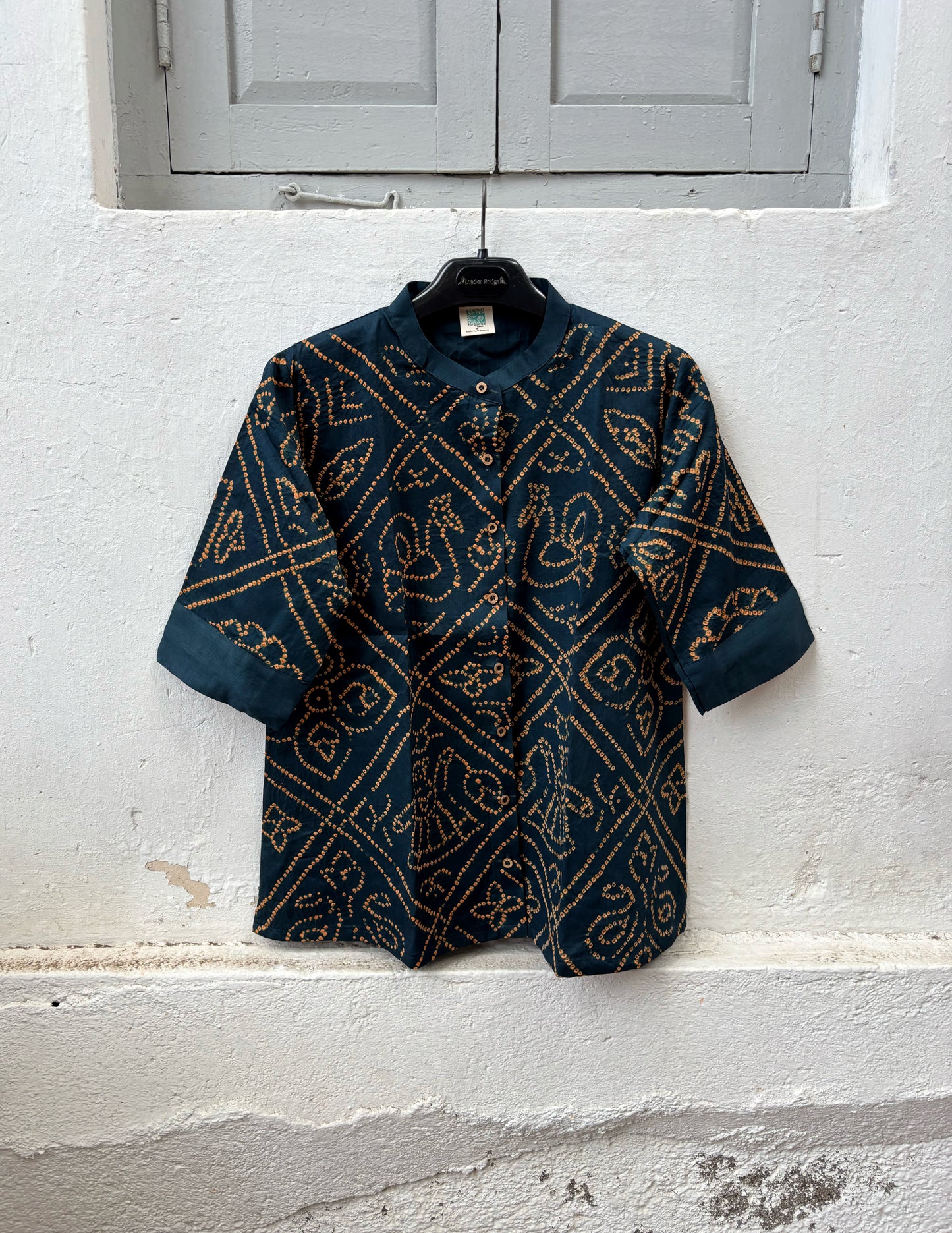 Midnight Blue hand tie-dyed Bandhani cotton shirt with warm Mustard geometric Bandhani motifs, Mandarin collar and relaxed fit from the Jhankar collection.
