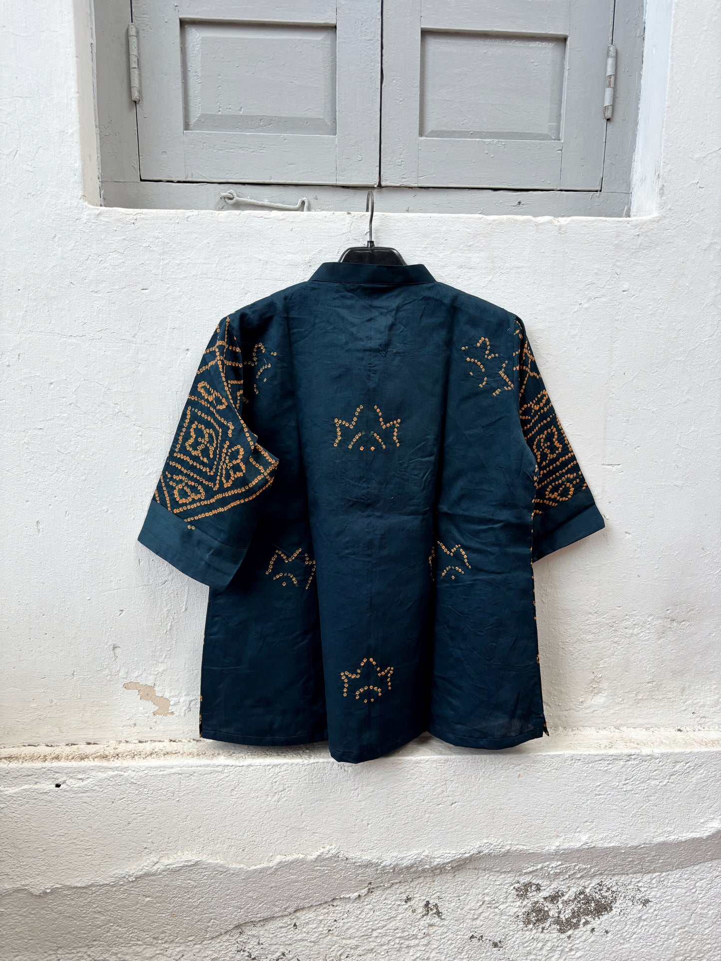 Midnight Blue hand tie-dyed Bandhani cotton shirt with warm Mustard geometric Bandhani motifs, Mandarin collar and relaxed fit from the Jhankar collection.
