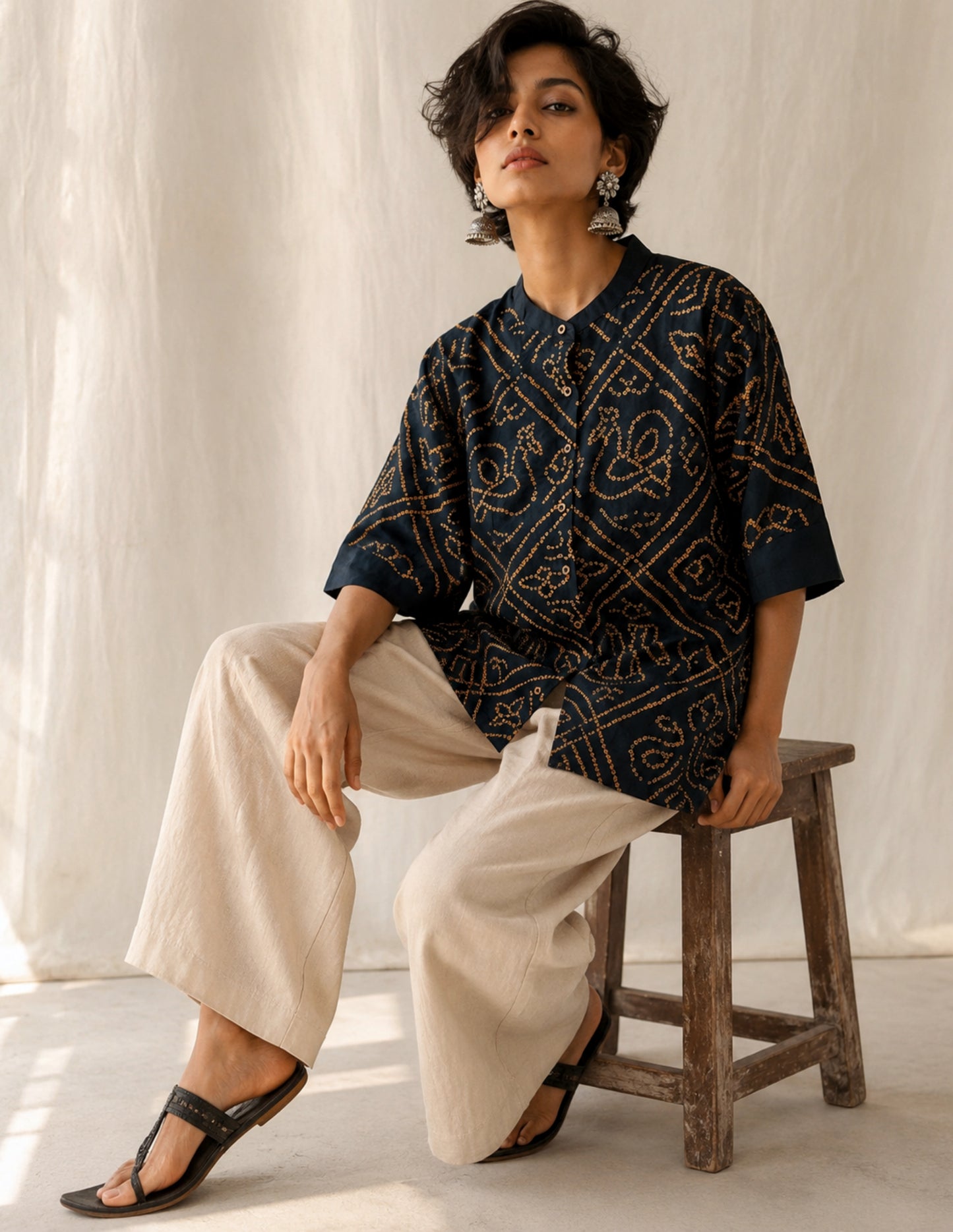 Midnight Blue hand tie-dyed Bandhani cotton shirt with warm Mustard geometric Bandhani motifs, Mandarin collar and relaxed fit from the Jhankar collection.