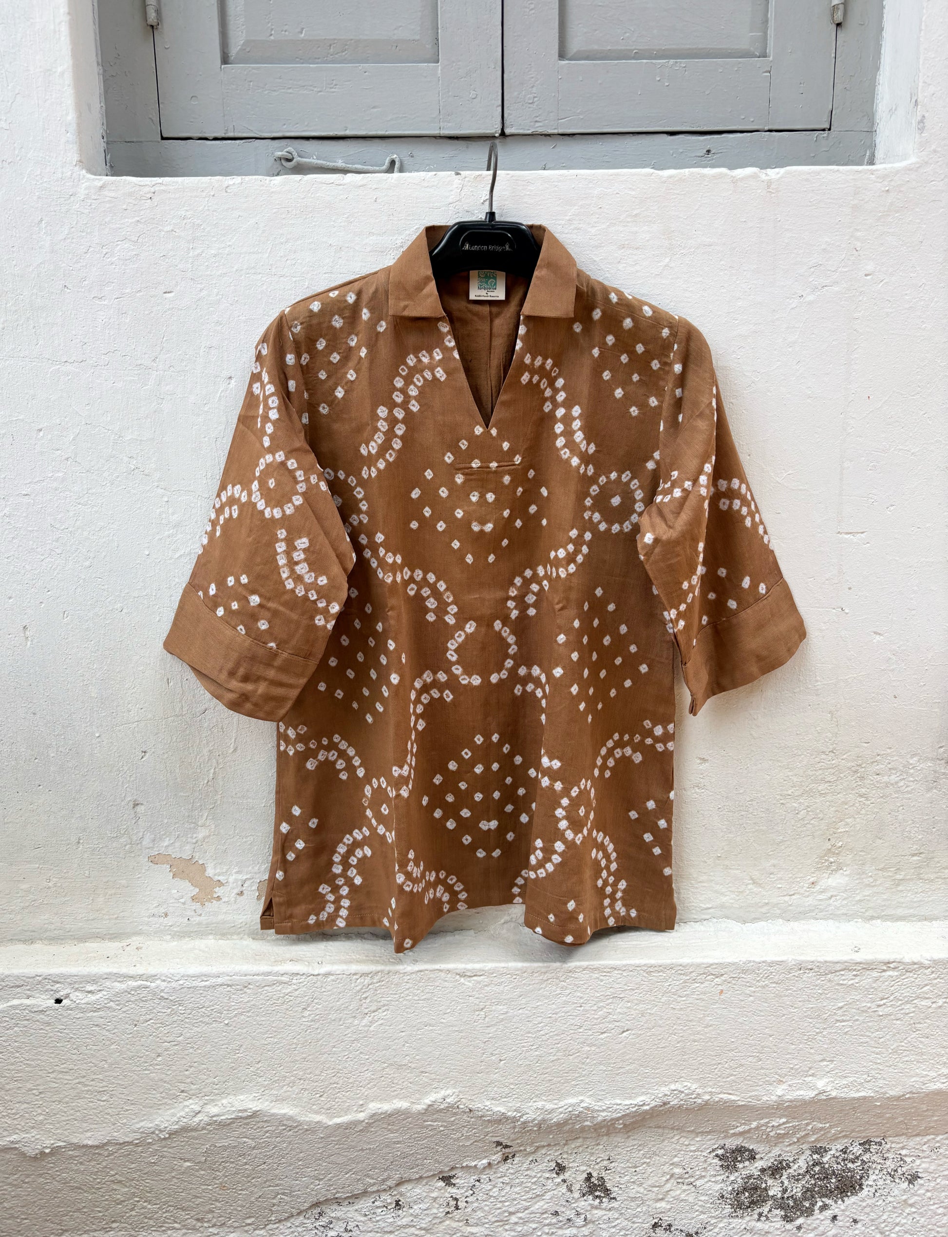 Toffee Brown Cotton Satin Bandhani Shirt with geometric hand tie-dyed motifs, open notch collar, V-neckline, relaxed fit, and elbow-length sleeves.