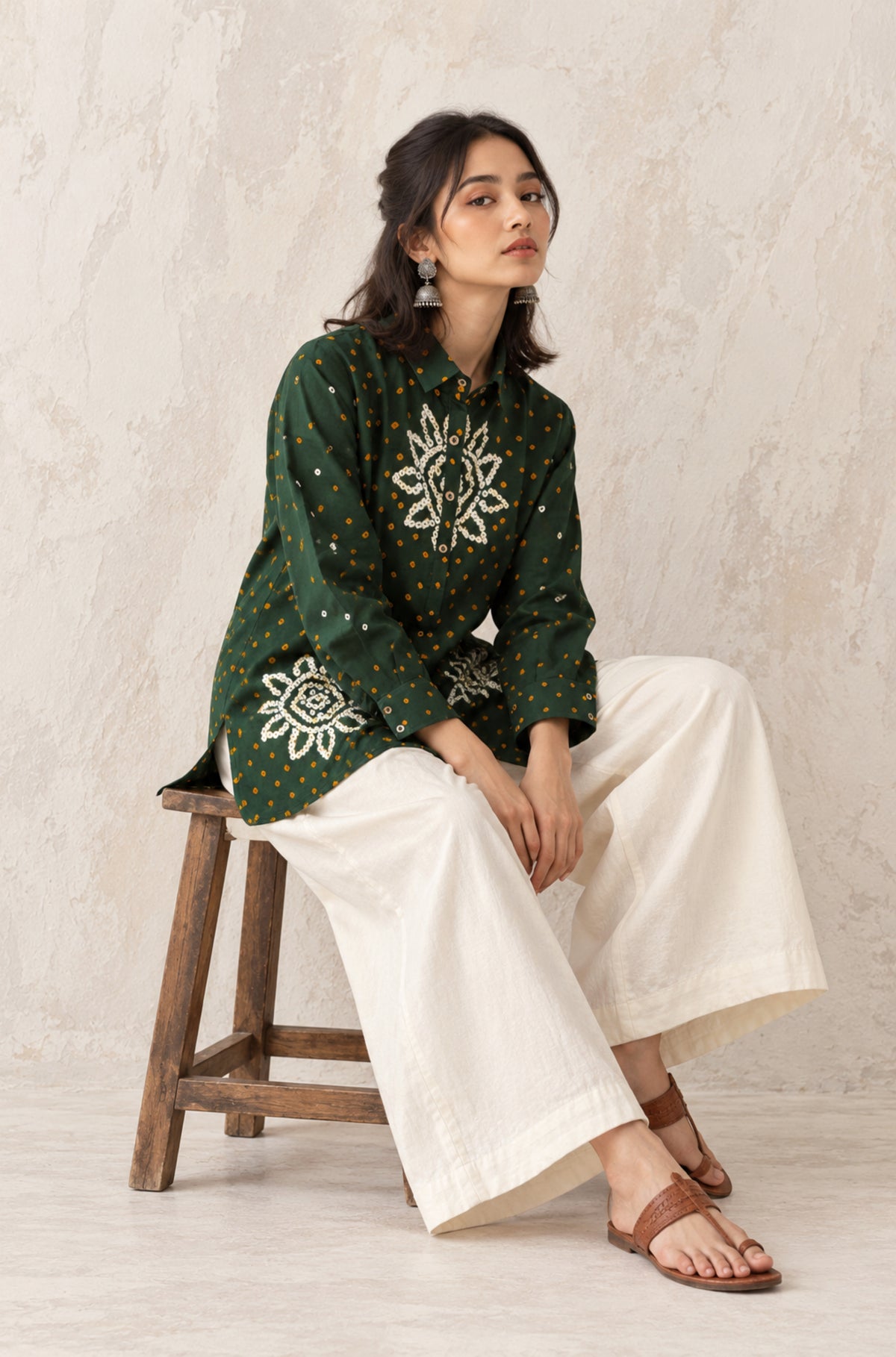 Vanrai deep green cotton shirt with turmeric-yellow Bandhani dots and off-white floral motifs on the front