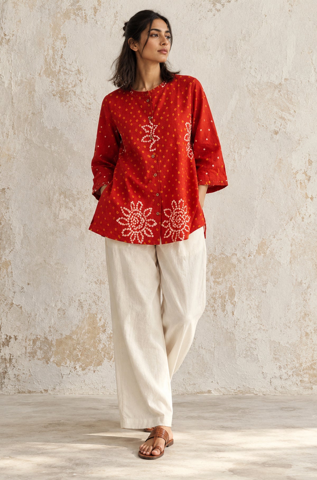 Vermilion orange cotton shirt with hand tie-dyed Bandhani, pleated neckline and three-quarter sleeves